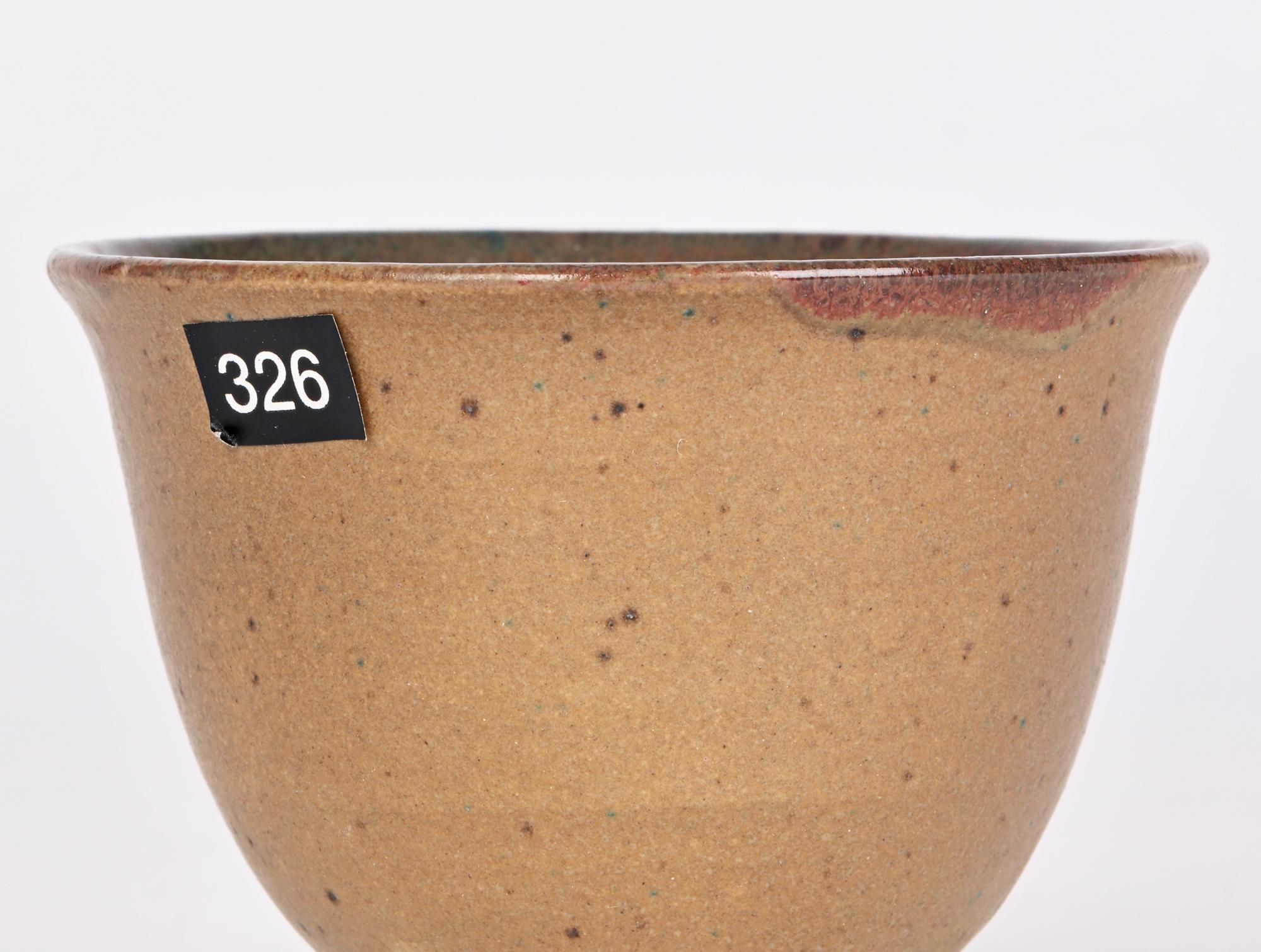 A very fine stoneware cup decorated in experimental glazes by renowned ceramic artist Eric James Mellon (British, 1925-2014) and dated 2006. 

Trained at the Central School of Arts and Crafts in London in the 1940’s Eric is more renowned for his