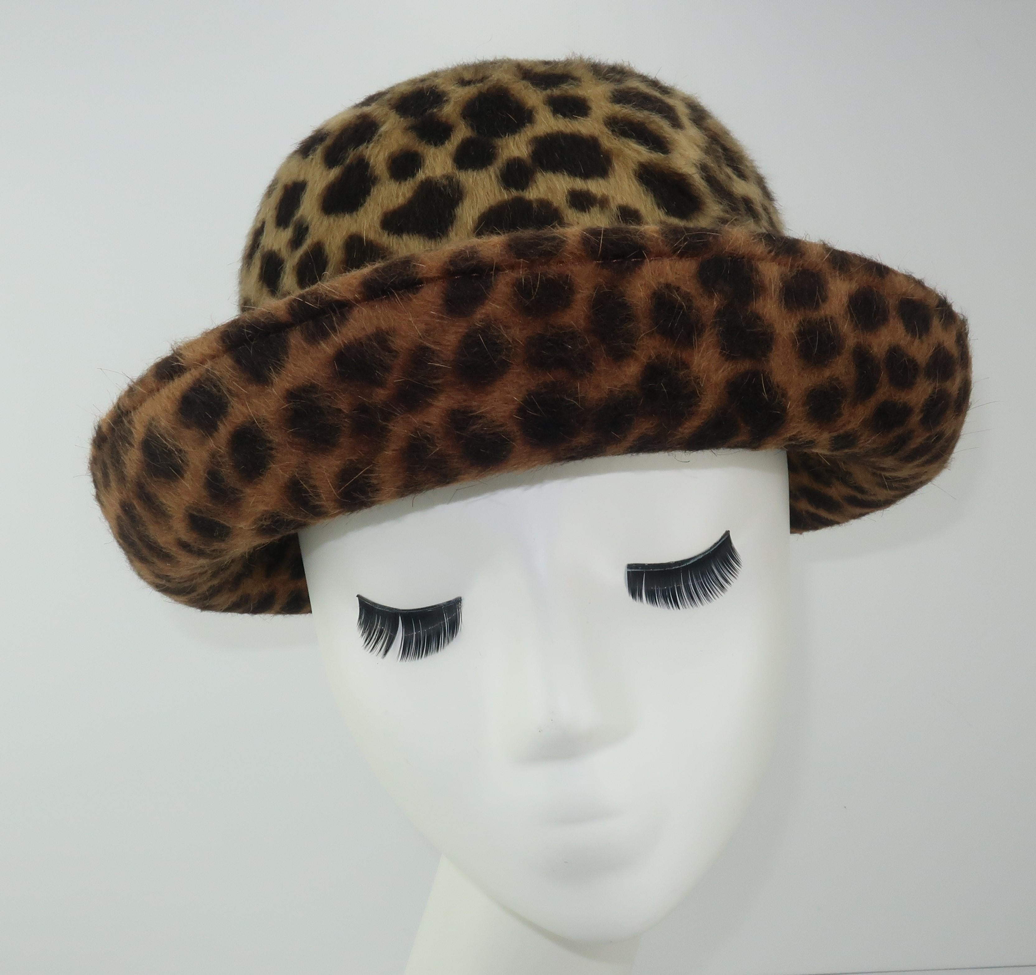 A bowler hat silhouette from Eric Javits with an animal print mohair in shades of dark brown to light camel.  It has a gradient pattern from crown to brim creating a subtle color shift from light to dark framing the face.  Eric Javits toppers are