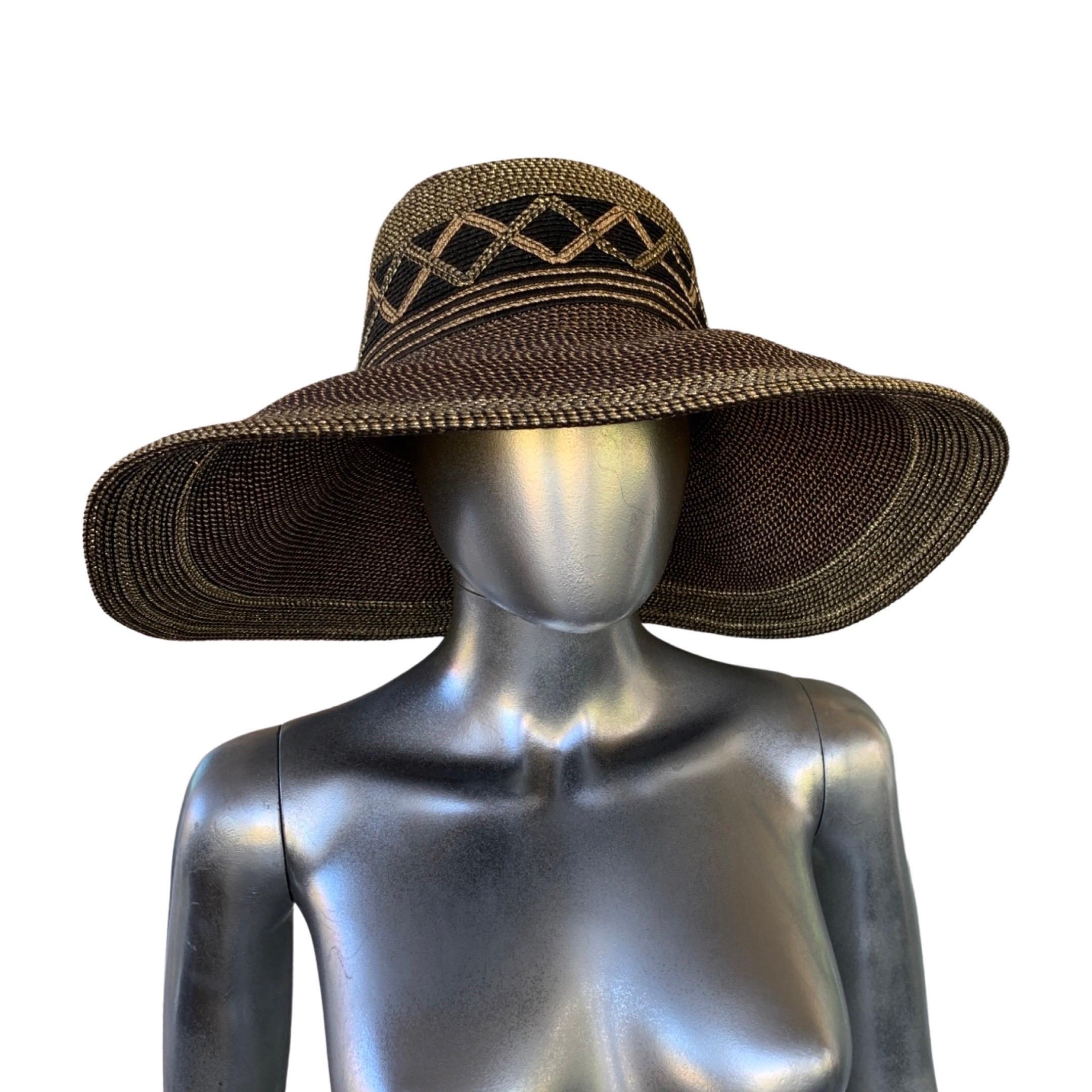 A vintage hat from NY Design legend Eric Javits. This is one of his famous “squichee” hat, which is desired by women all over the world. The bronze and black style was sold out everywhere. Very chic and glamorous. The large hat frames the face, with