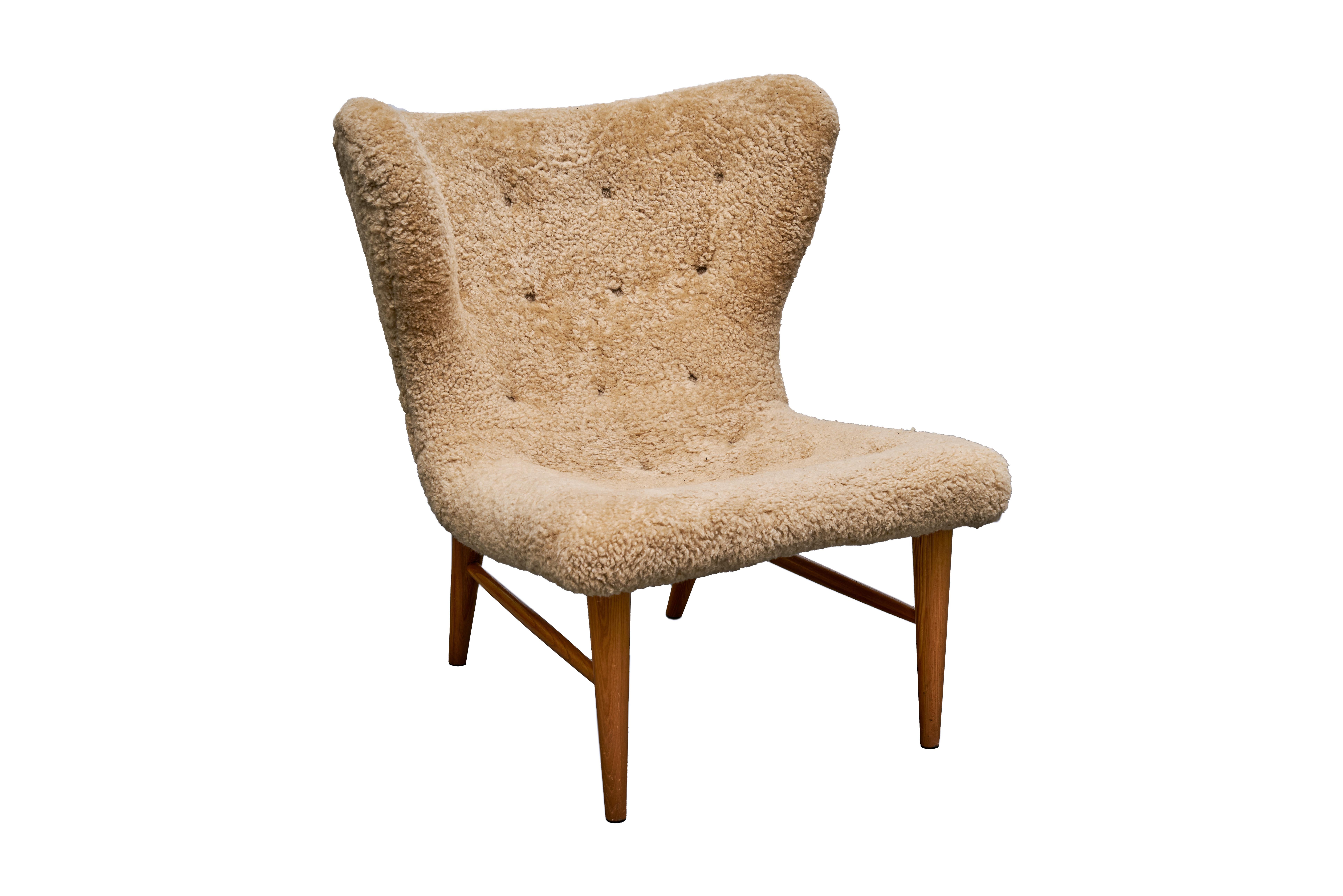 A pair of lounge chairs designed by Eric Karlén. This set was crafted in the 1940s and curated exclusively for Firma Rumsinteriör. These remarkable pieces showcase the perfect fusion of sophisticated design, superior craftsmanship, and supreme