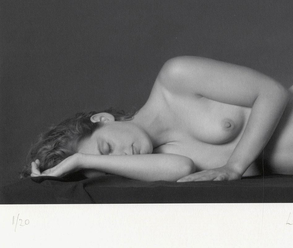 Lying Nude (Long-legged full frontal female nude lying prone on her right side) - Photograph by Eric Kellerman (b. 1944)