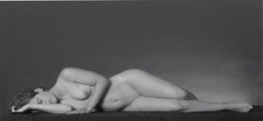Lying Nude (Long-legged full frontal female nude lying prone on her right side)