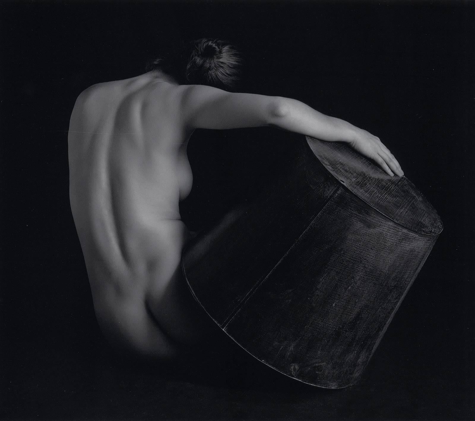 Eric Kellerman (b. 1944) Nude Photograph - Nude with Zinc Vessel (The back view of a nude woman holding a zinc object)