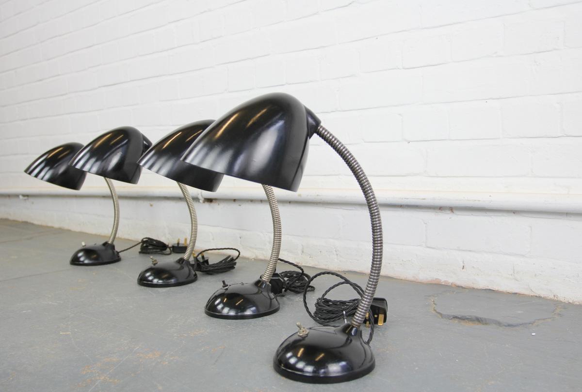 Eric Kirkman cole gooseneck desk lamps, circa 1930s.

- Price is per lamp (6 available)
- Fully re wired
- Original inline switches
- Bakelite shade and base
- Steel adjustable gooseneck
- Czech, circa 1930s.
- 38cm tall x 15cm x