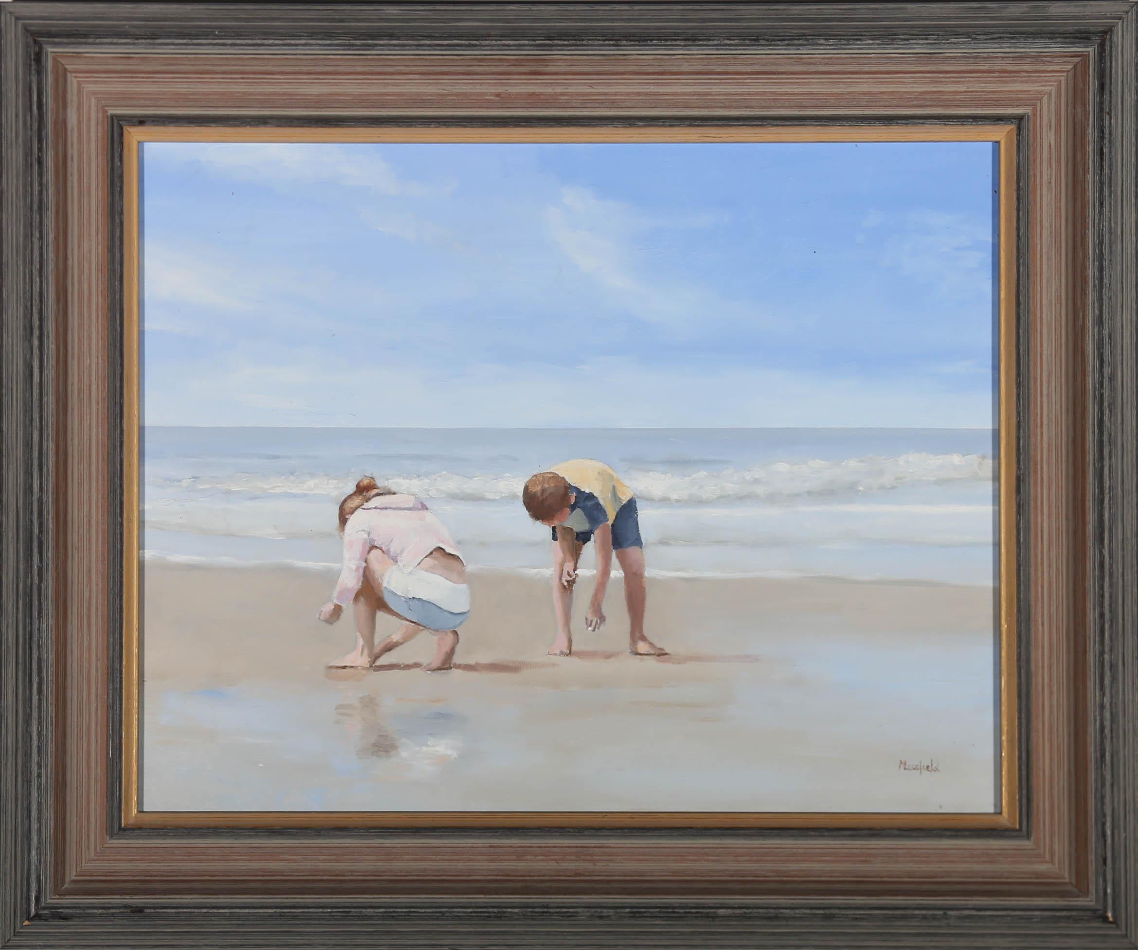 A bright and sunny beach scene in oil, showing two children combing the wet sand for shells. The artist has signed to the lower right corner and the painting has been presented in a 20th Century wood frame. There is a label at the reverse with the