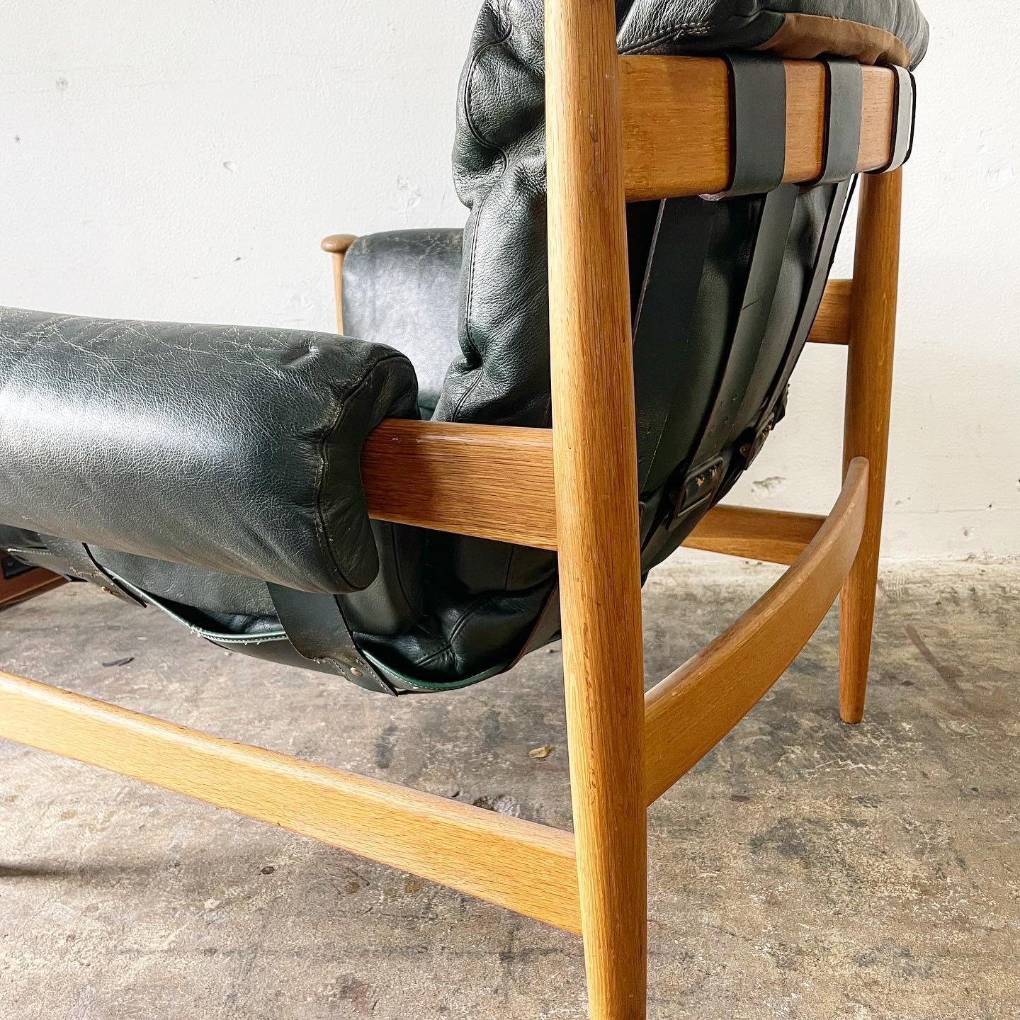 Eric Merthen “Amiral” Chair. Original Dark Green Leather. Some restoration on one strap on seat.