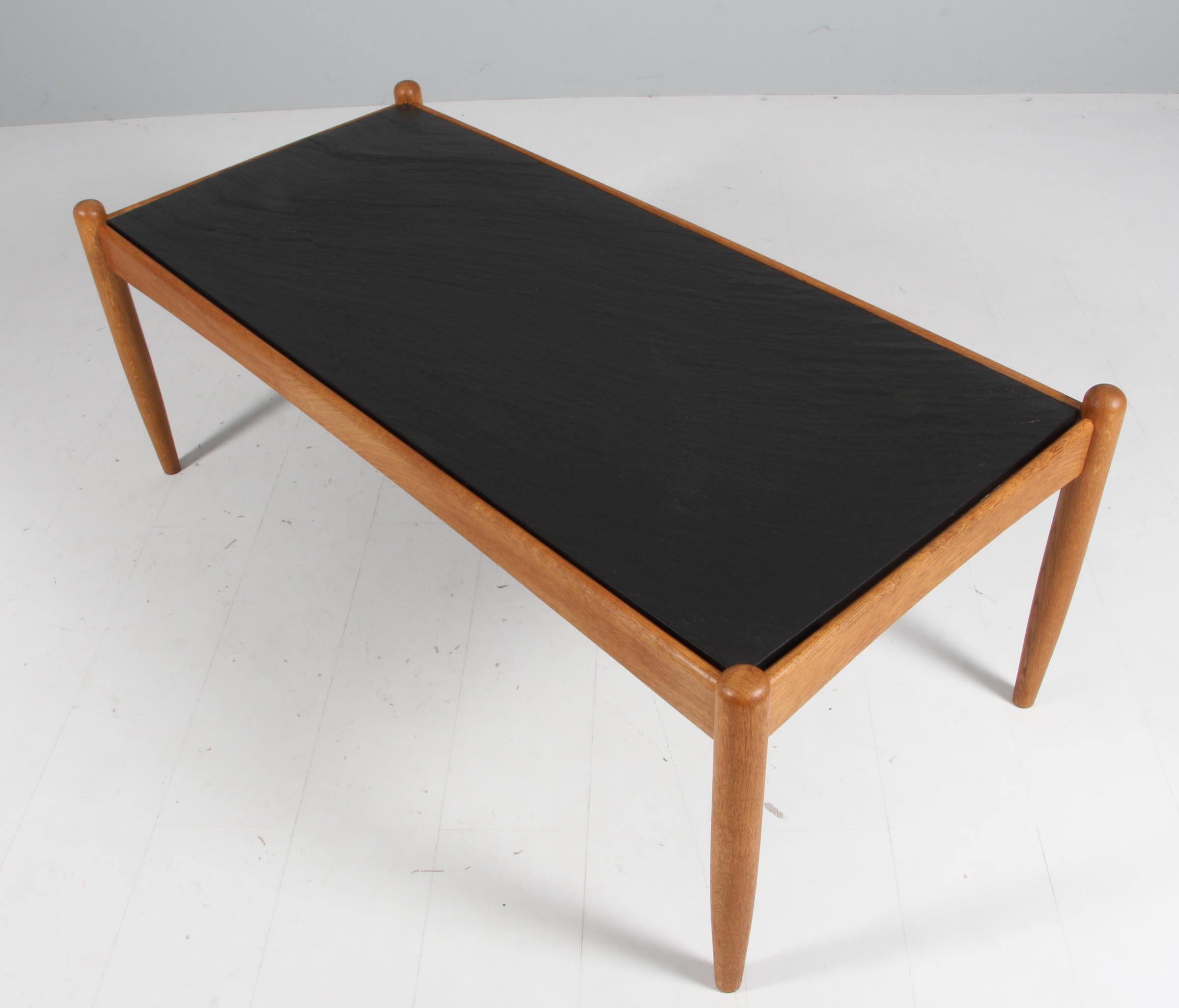 Low table in oak with slate top. Designed by Eric Merthen. Made in Sweden in the 1960s. Great original condition.
