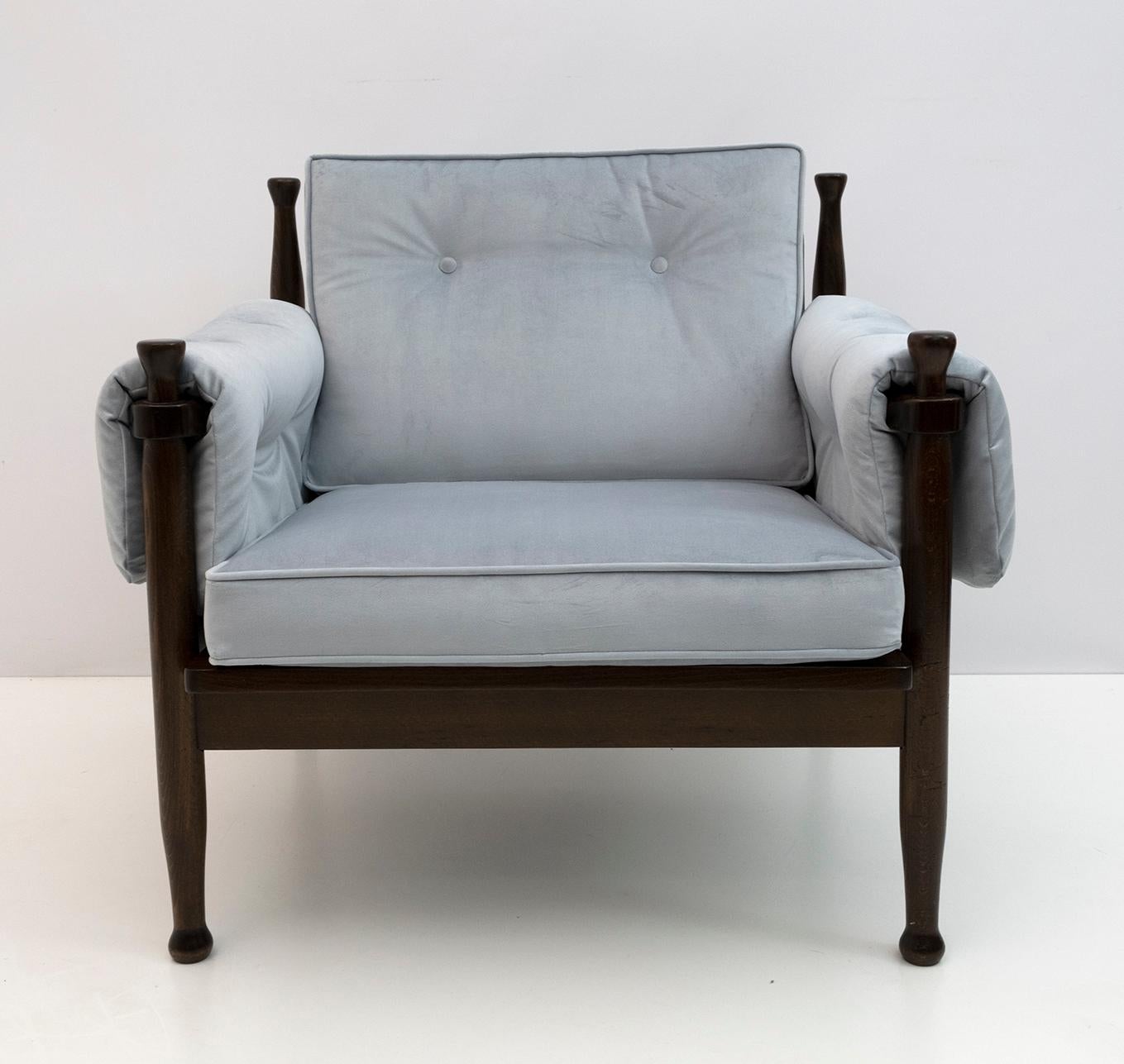 Armchair in walnut-stained beech, in the style of Eric Merthen, Sweden in the 1960s, the armchair has been restored and re-upholstered in light blue velvet.