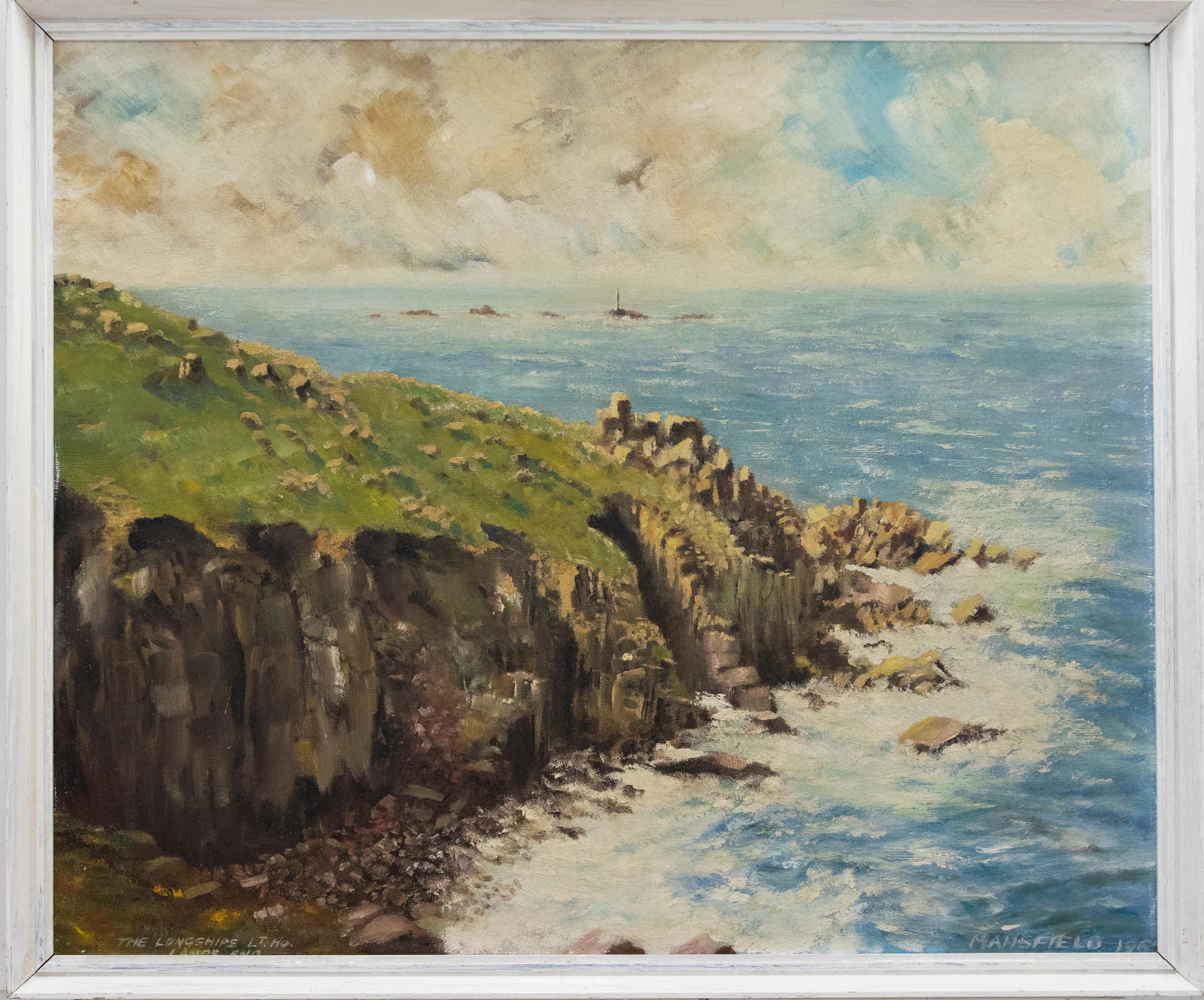 A dramatic coastal scene in oil, looking across headland to Longships lighthouse at Lands End. The artist has captured white waves crashing against fallen rock and rugged cliffs, with the landmark lighthouse standing solemn, further out at sea. The