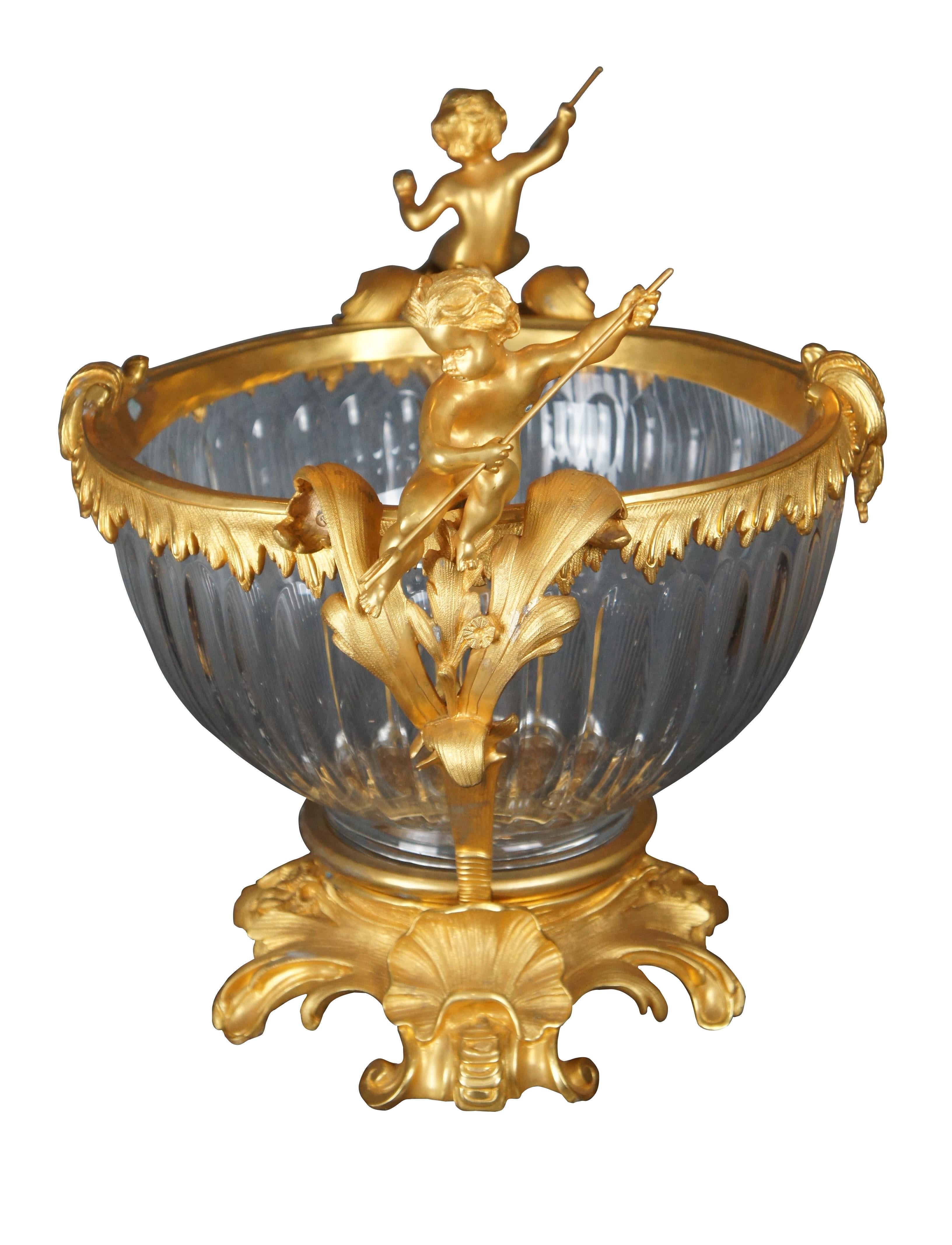 Late 20th Century Eric Stepnewski centerpiece bowl. Crafted from chiseled brass ormolu finished in 24k gold and crystal. Perfectly suited to function as a champagne bowl or simply as a decorative vase or centerpiece Features a gadrooned cut crystal