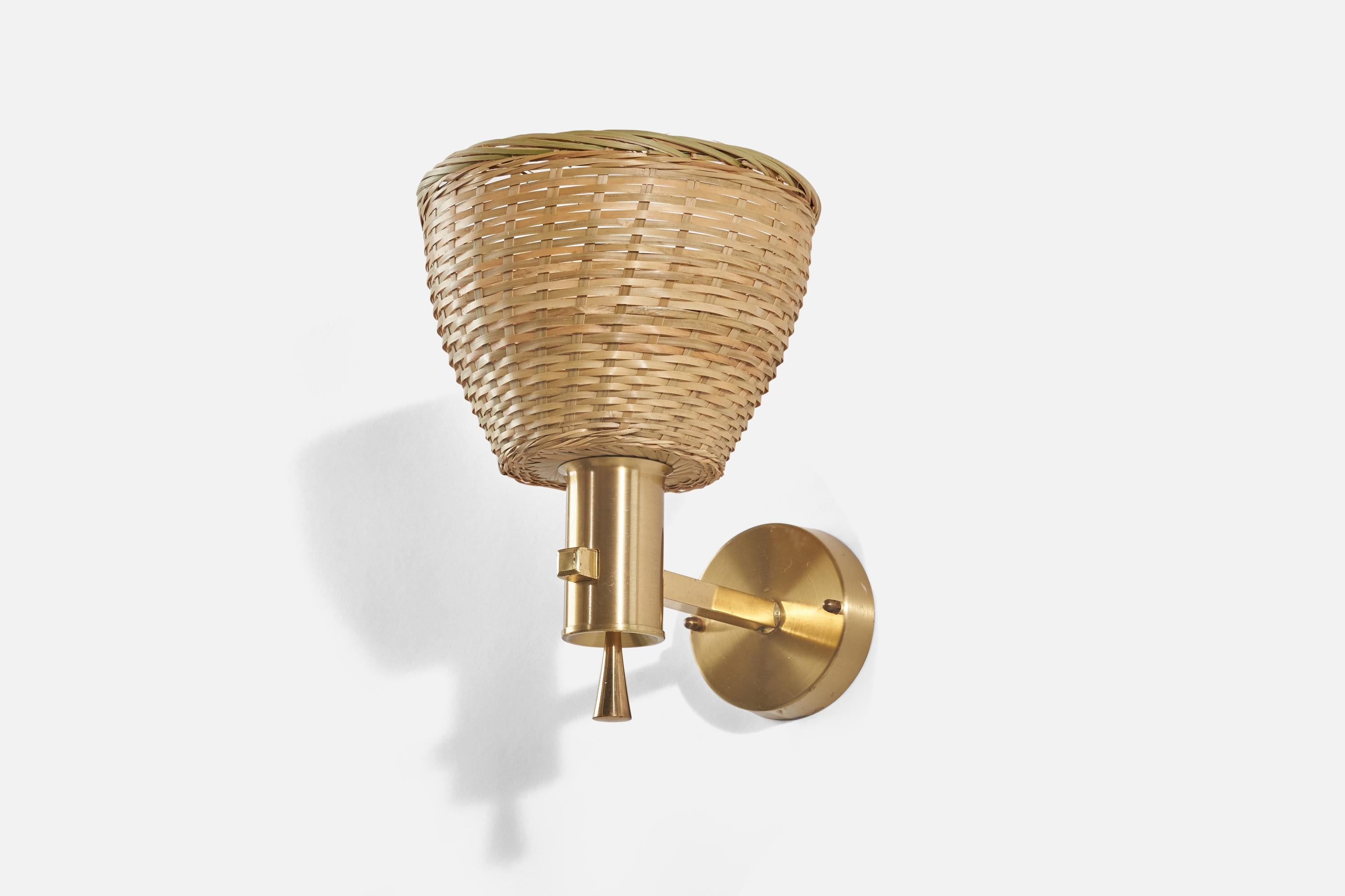 A brass and rattan wall light designed and produced by Eric Wärnå, Sweden, c. 1960s. 

Sold with lampshade(s). Dimensions stated are of Sconce with Shade(s).

Dimensions of back plate (inches) : 3.54 x 3.54 x 0.90 (height x width x