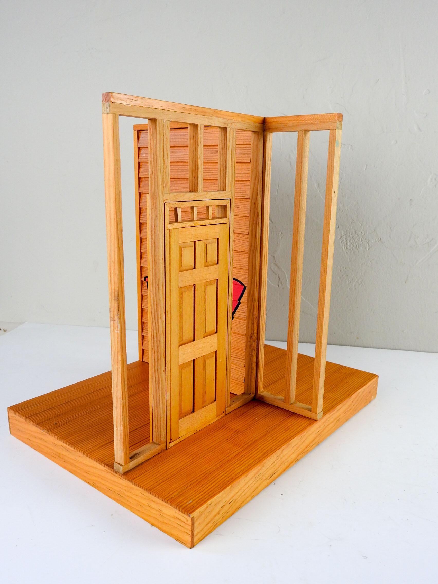 Intricate sculpture in wood of a deconstructed house by Eric C. Weller (20th century) Texas. Graffiti signed ECW in pink and black, working window with plexiglass panes, working door. The craftsmanship is excellent, very well built and beautiful