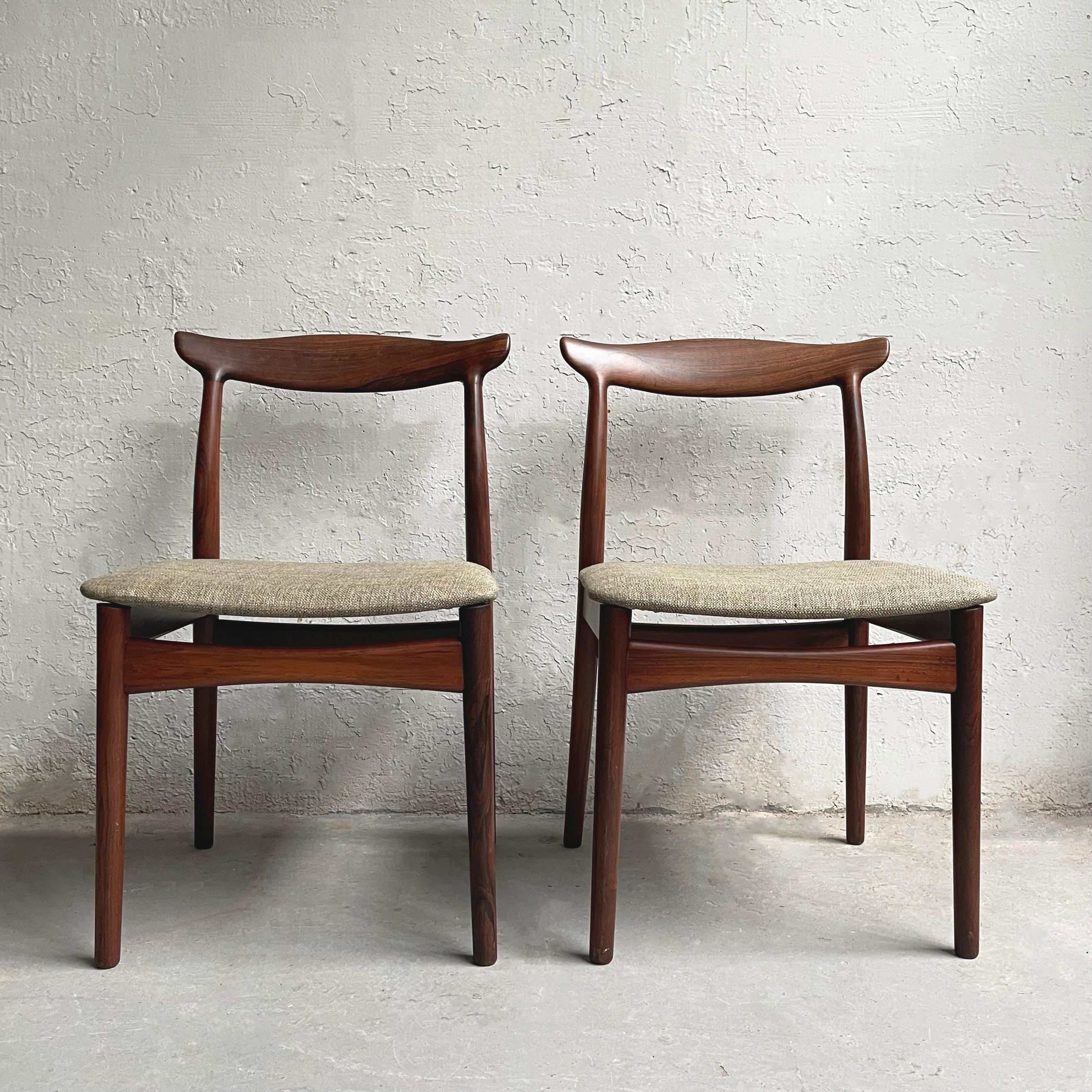 Pair of elegant, Danish modern, model 112 chairs by Erik Wørts for Vamo Møbelfabrik feature rosewood frames with cow horn backs and floating upholstered seats in muted green tweed.