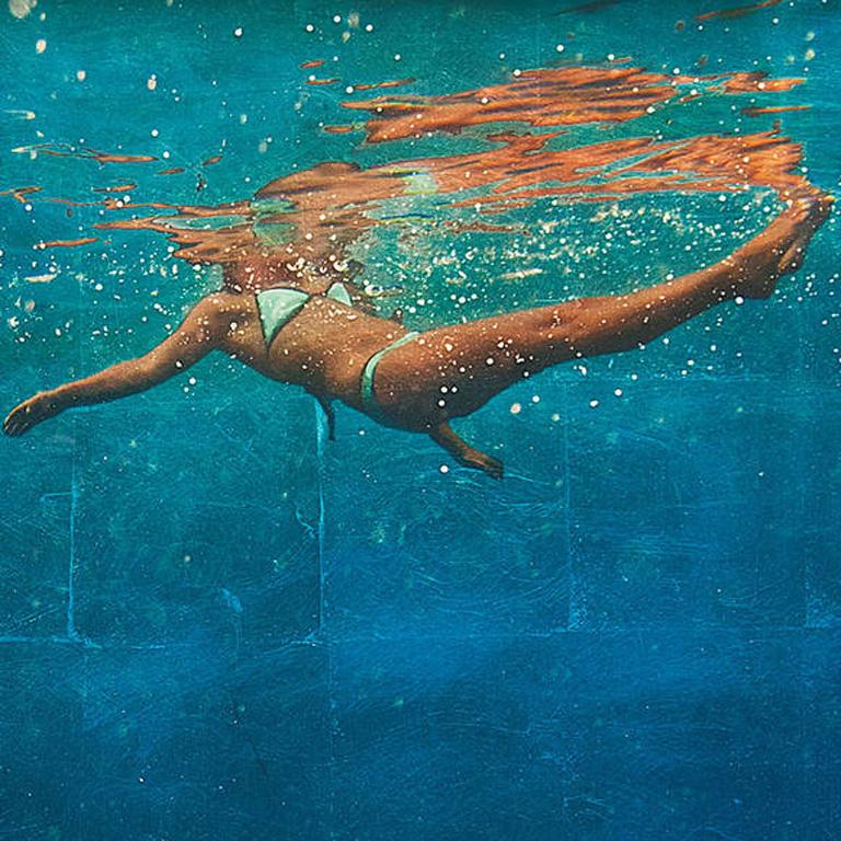 A swimming woman figure, viewed from under the water.

Eric Zener’s photorealistic paintings and resins are focused on four motifs: landscapes, figures in bed or on tightropes, and bodies in water. Zener manipulates light to create psychologically