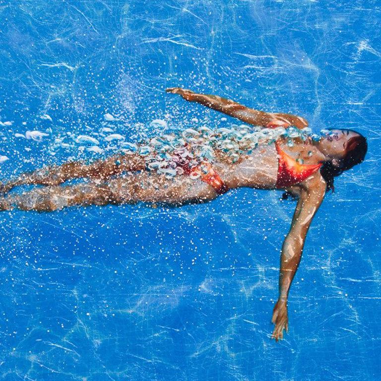 EXHALATION IN BLUE, women in water, deep blue, light reflecting off pool, sunny - Photograph by Eric Zener