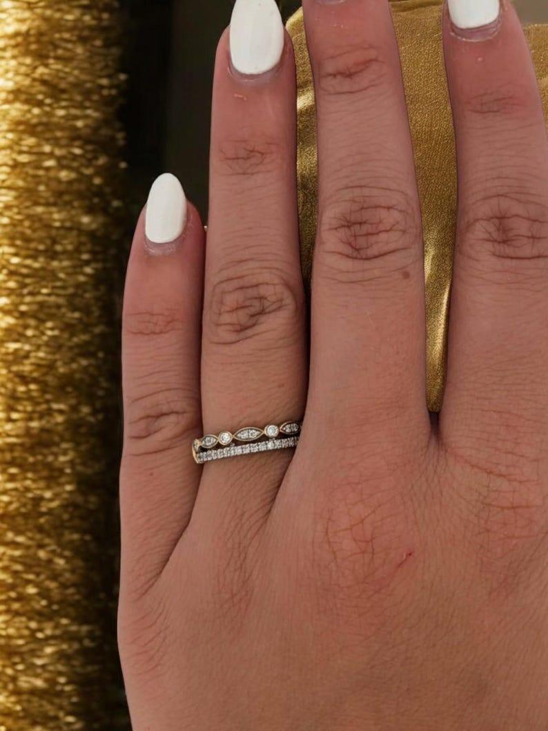 The Peridot Ring is a modern take on timeless elegance, designed to give the illusion of two perfectly stacked bands in one stunning piece. Crafted in glowing 14K yellow gold, this ring is adorned with 0.25ct of natural round diamonds, prong set for
