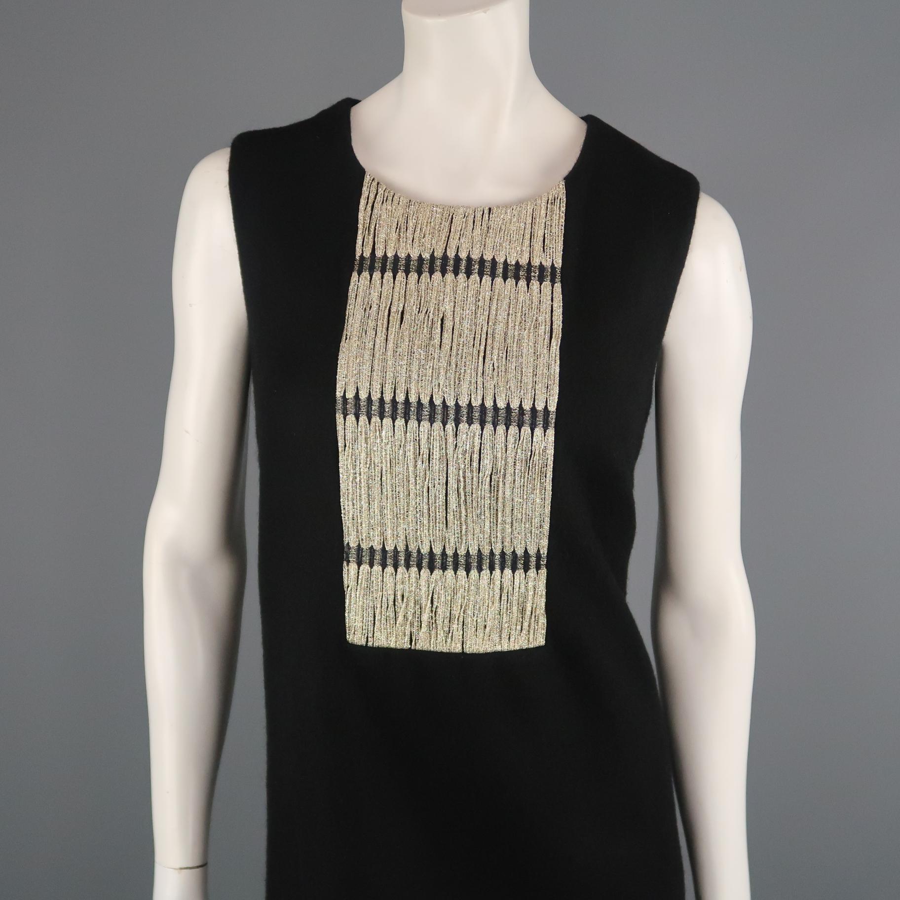 Sleeveless ERICA TANOV cocktail dress comes in wool blend felt with a round neck, shift silhouette, side slits, and metallic gold bib applique. Made in USA.
 
Excellent Pre-Owned Condition.
Marked: JP 3
 
Measurements:
 
Shoulder: 13 in.
Bust: 38