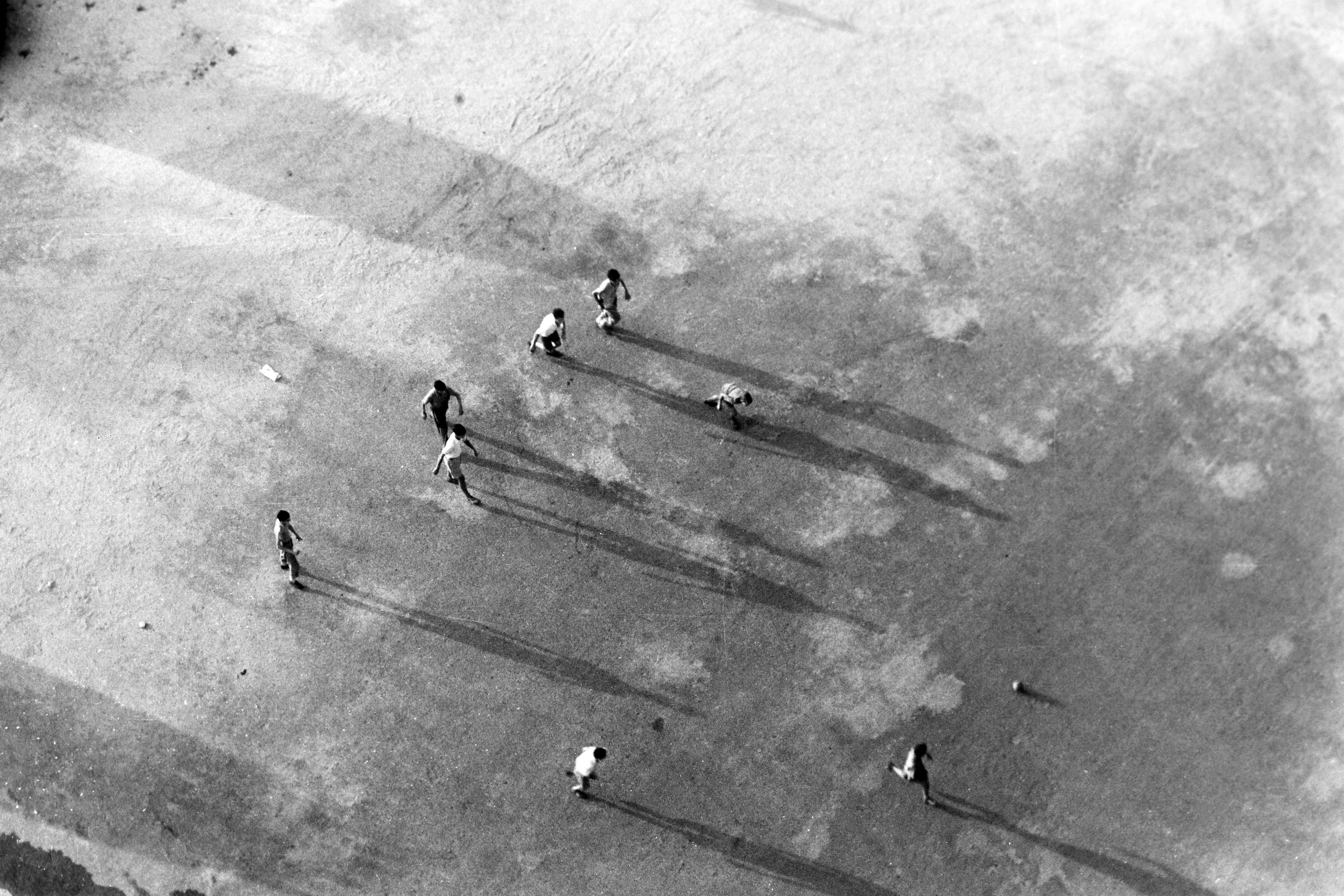 Erich Andres Black and White Photograph - Andres: Children playing street soccer, Barcelona 1957.