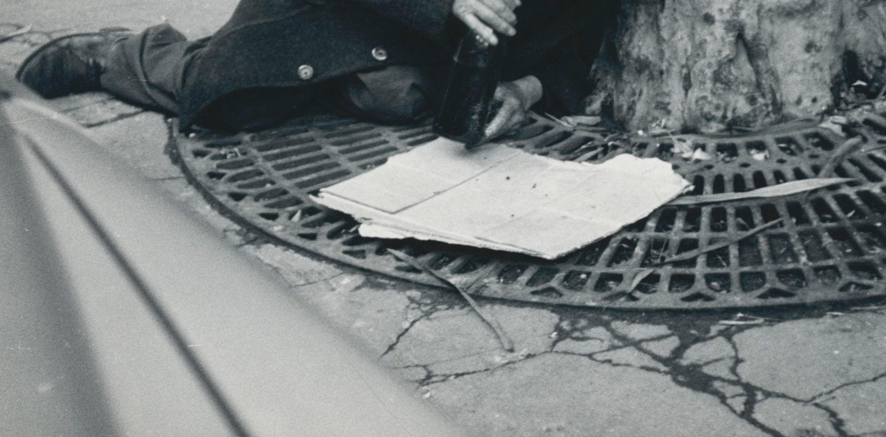 Homeless man, Street Photography, Paris, France 1950s, 12, 8 x 18 cm - Gray Black and White Photograph by Erich Andres