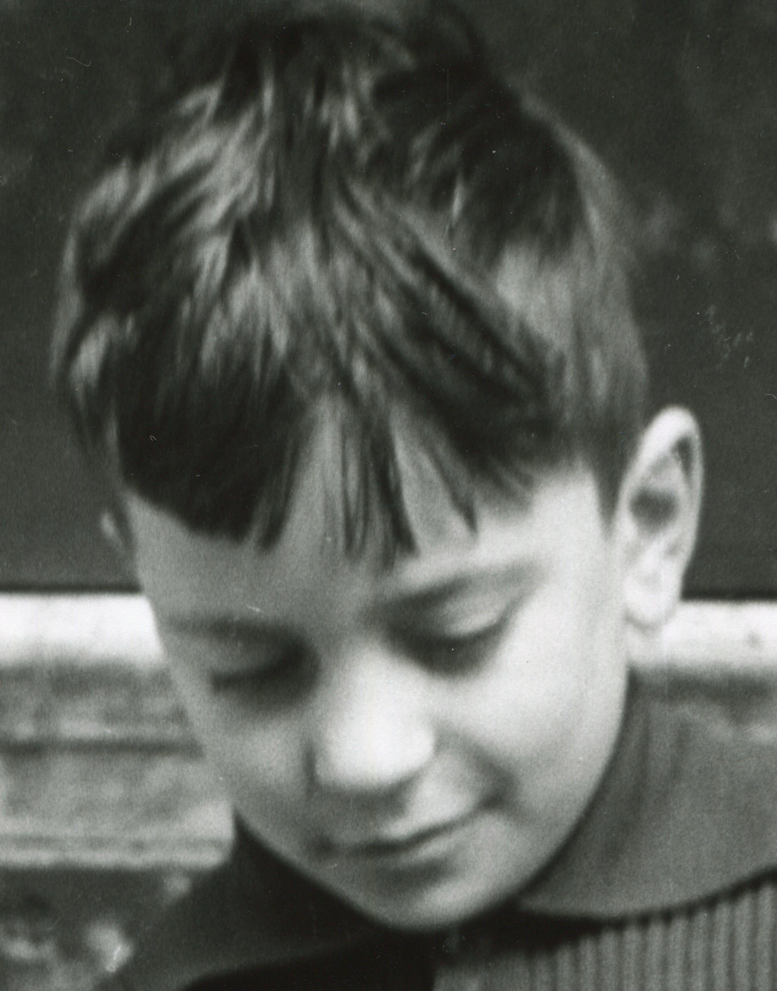 Italy 1956 - Boy reading a newspaper - Photograph by Erich Andres