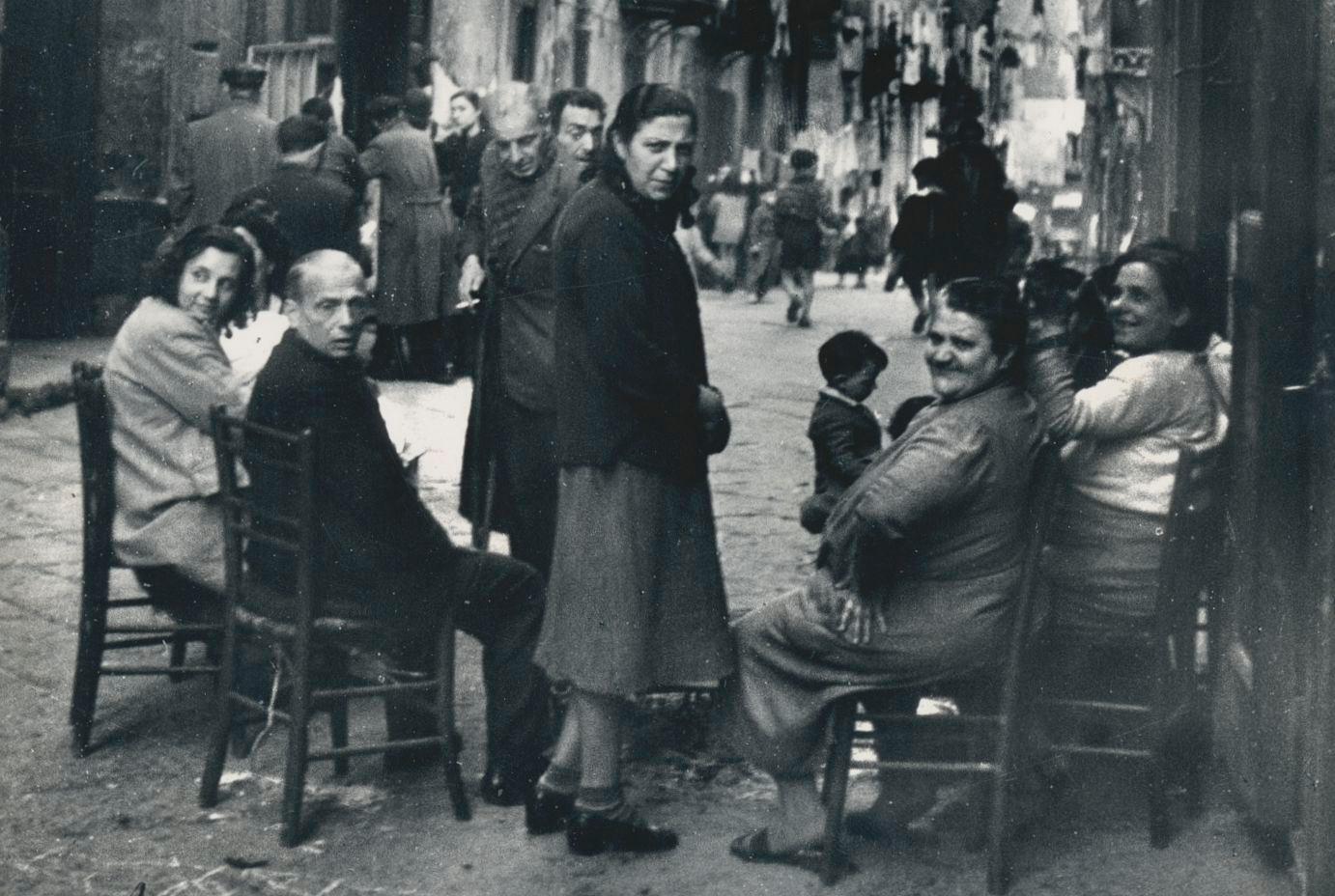 Naples - People sitting on the streets, Italy 1950s - Photograph by Erich Andres