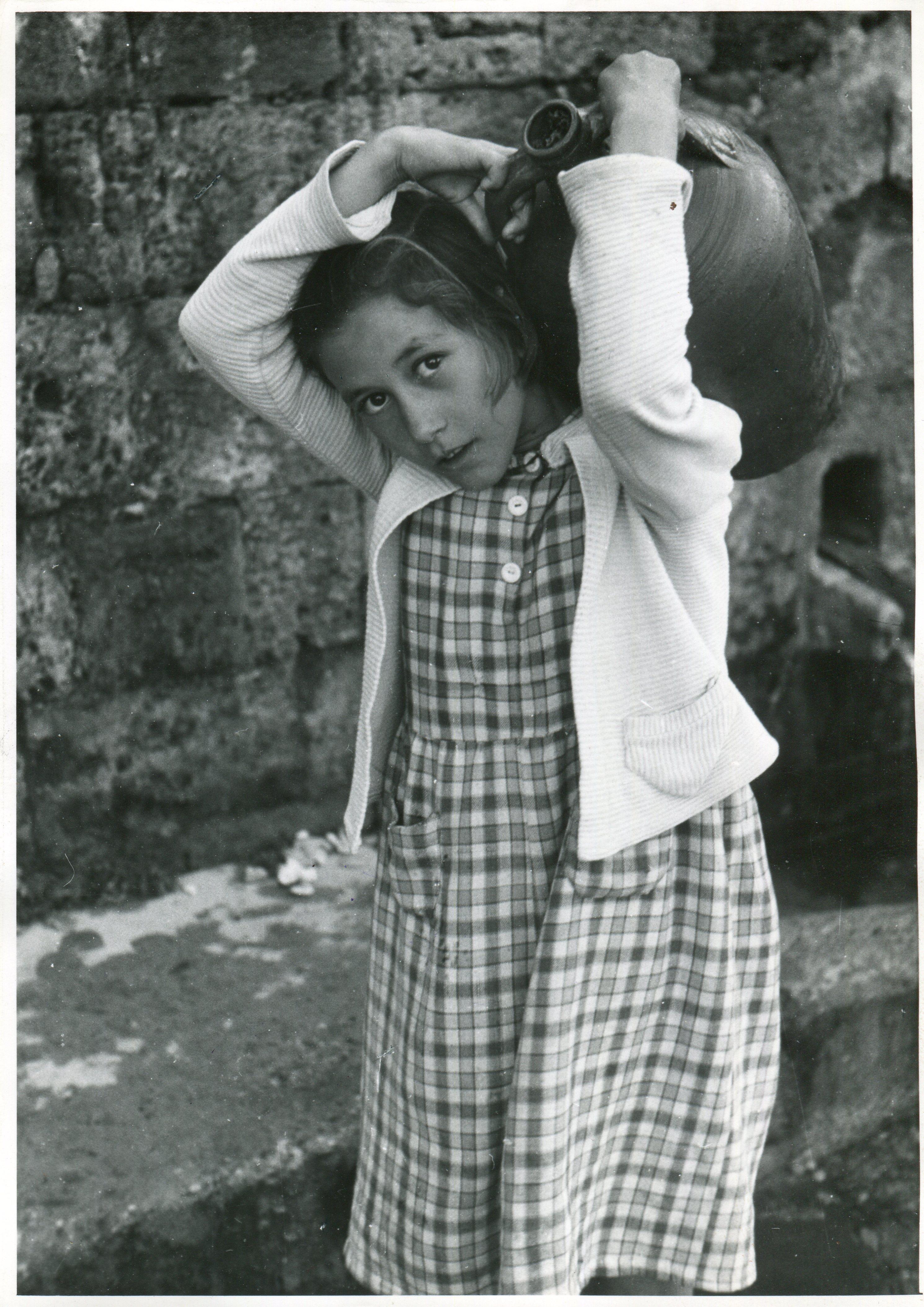 Erich Andres Black and White Photograph - Rhodos - Girl with water jug