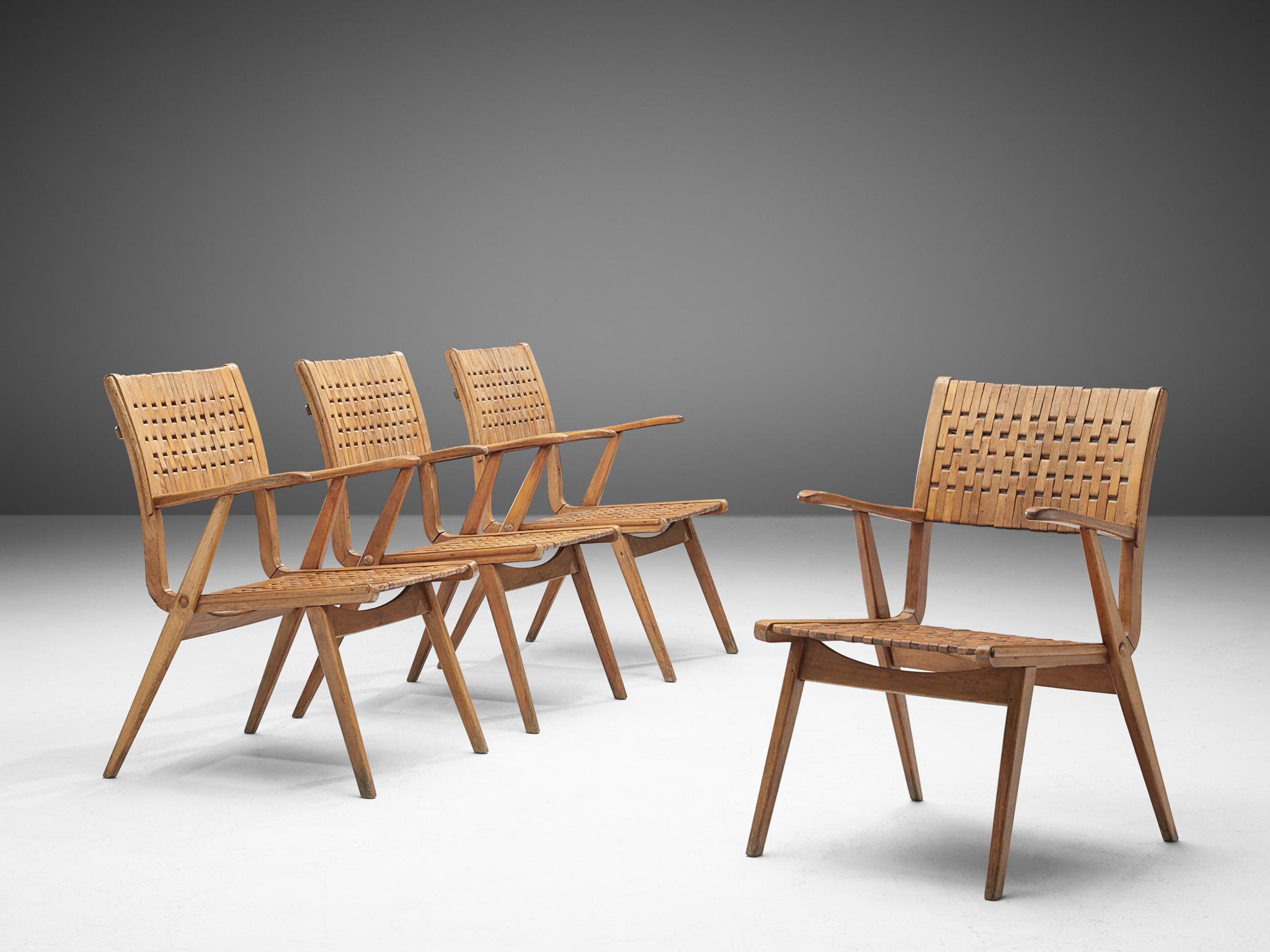 Erich Dieckmann, armchairs, plywood, webbing, Germany, 1930s.

This German set is executed with bent plywood and solid wooden seat with a webbed back. The style is typical for prewar German design. The chairs are modest yet refined by means of the