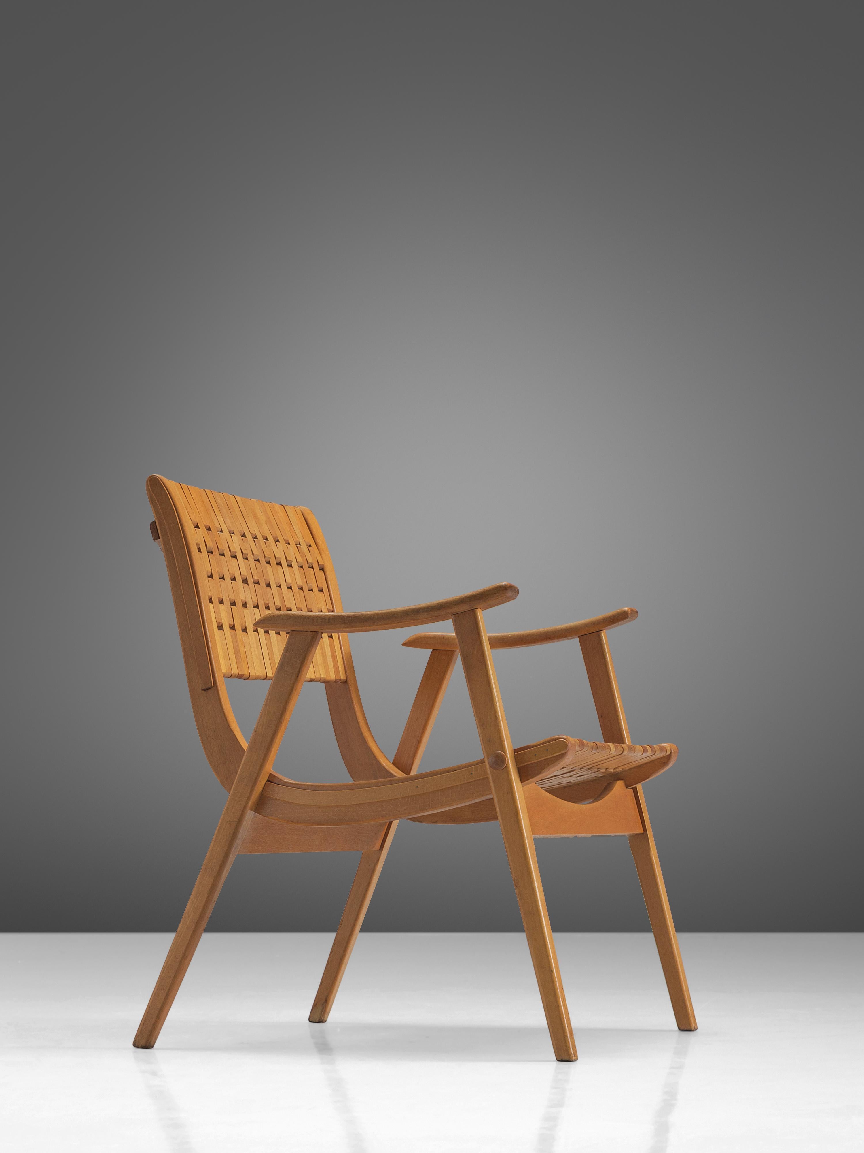 Erich Diekmann for Gelenka Tyskland, bent beech plywood, Germany, circa 1930.

This chair is designed by the German designer Erich Dieckmann who was affiliated to Bauhaus. The chair is executed with typical bent plywood and a webbed back. The style