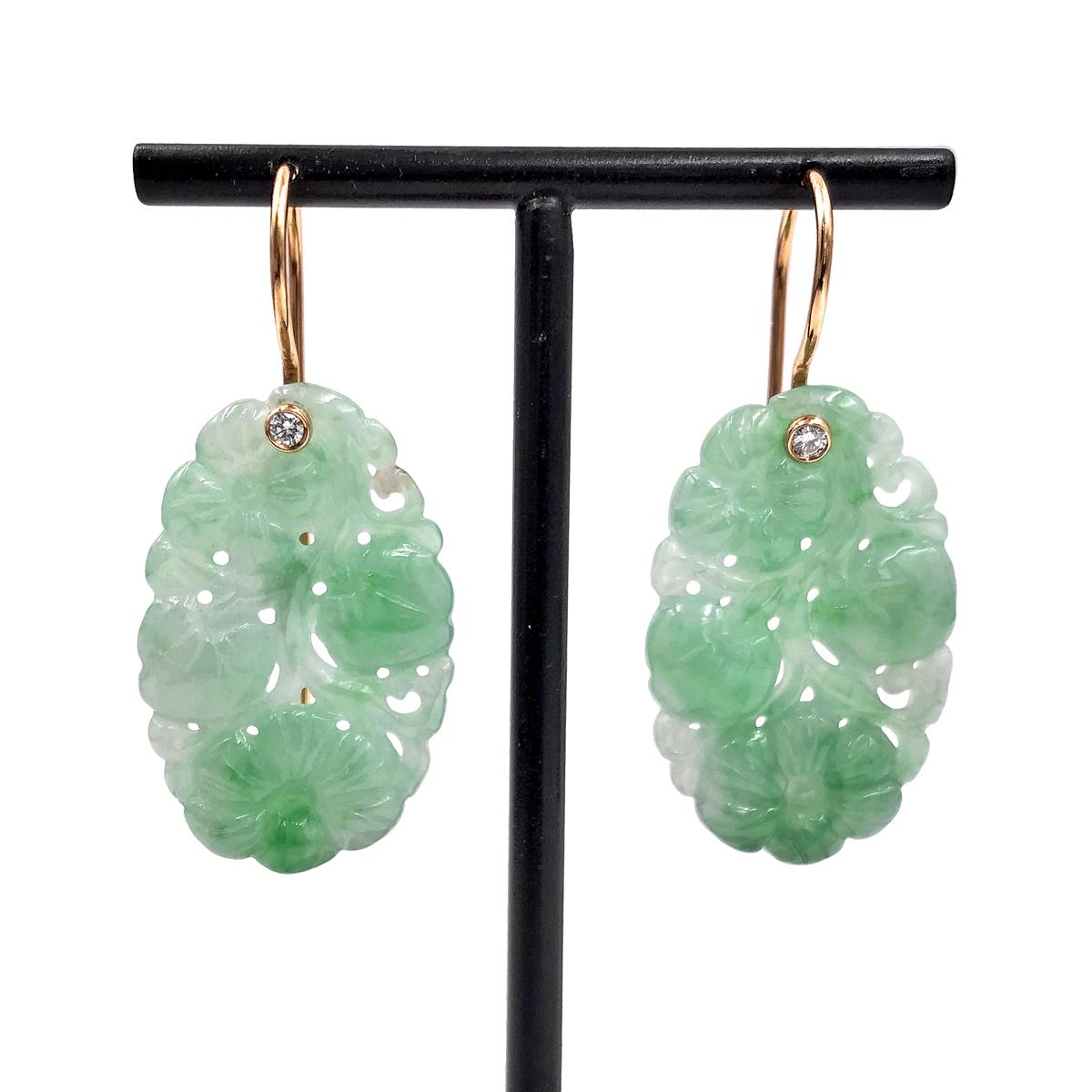 One of a Kind Earrings handcrafted in Germany by renowned master metalsmith Erich Zimmermann, featuring an exquisite 24.79 total carat matched pair of carved light green jadeite. The stunning gemstones dangle beautifully from handmade 18k rose gold