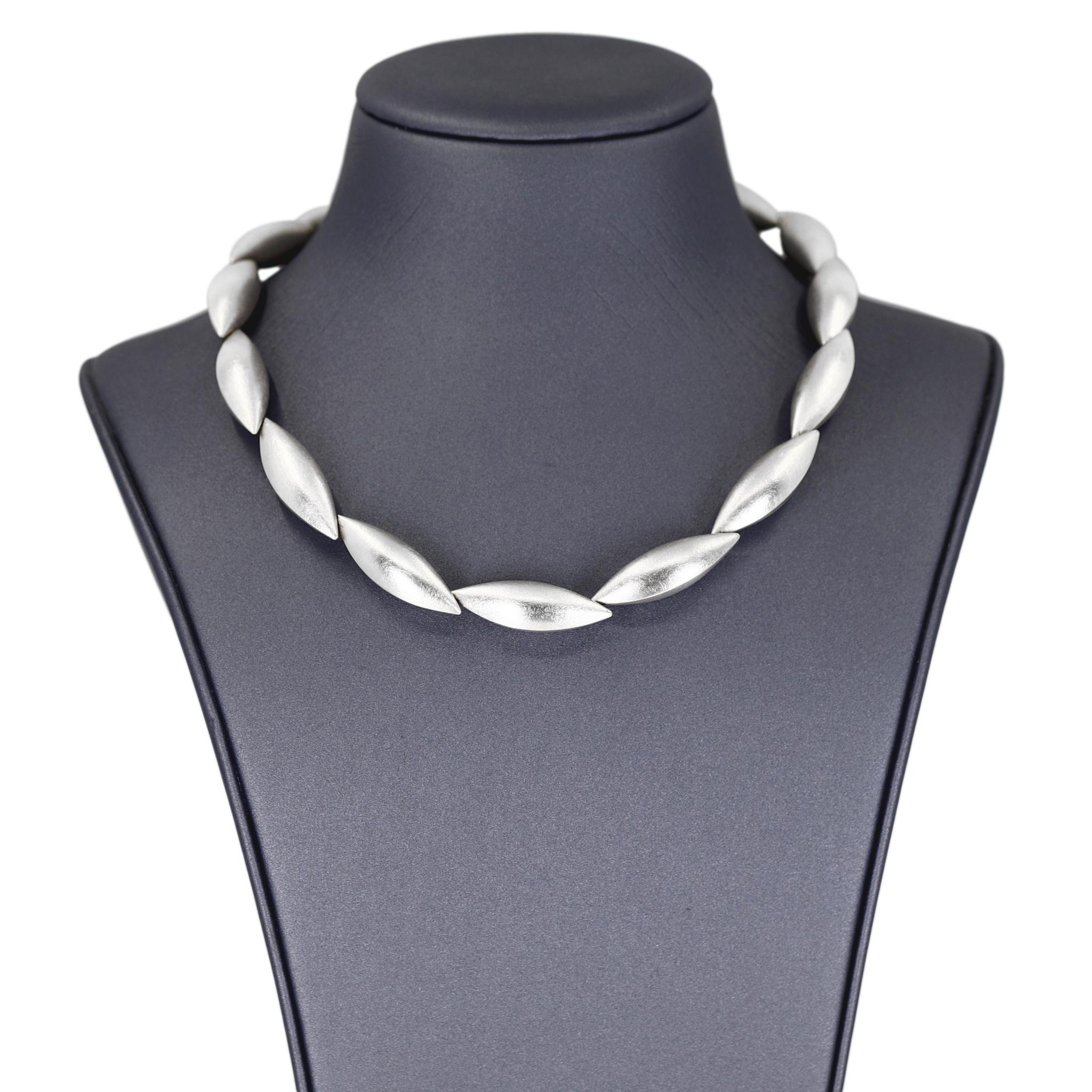 Cocoon Necklace handcrafted in Germany by acclaimed master metalsmith and jewelry maker Erich Zimmermann in signature, fine silver-brushed sterling silver, featuring fifteen hand-fabricated cocoon elements that interconnect to one another invisibly