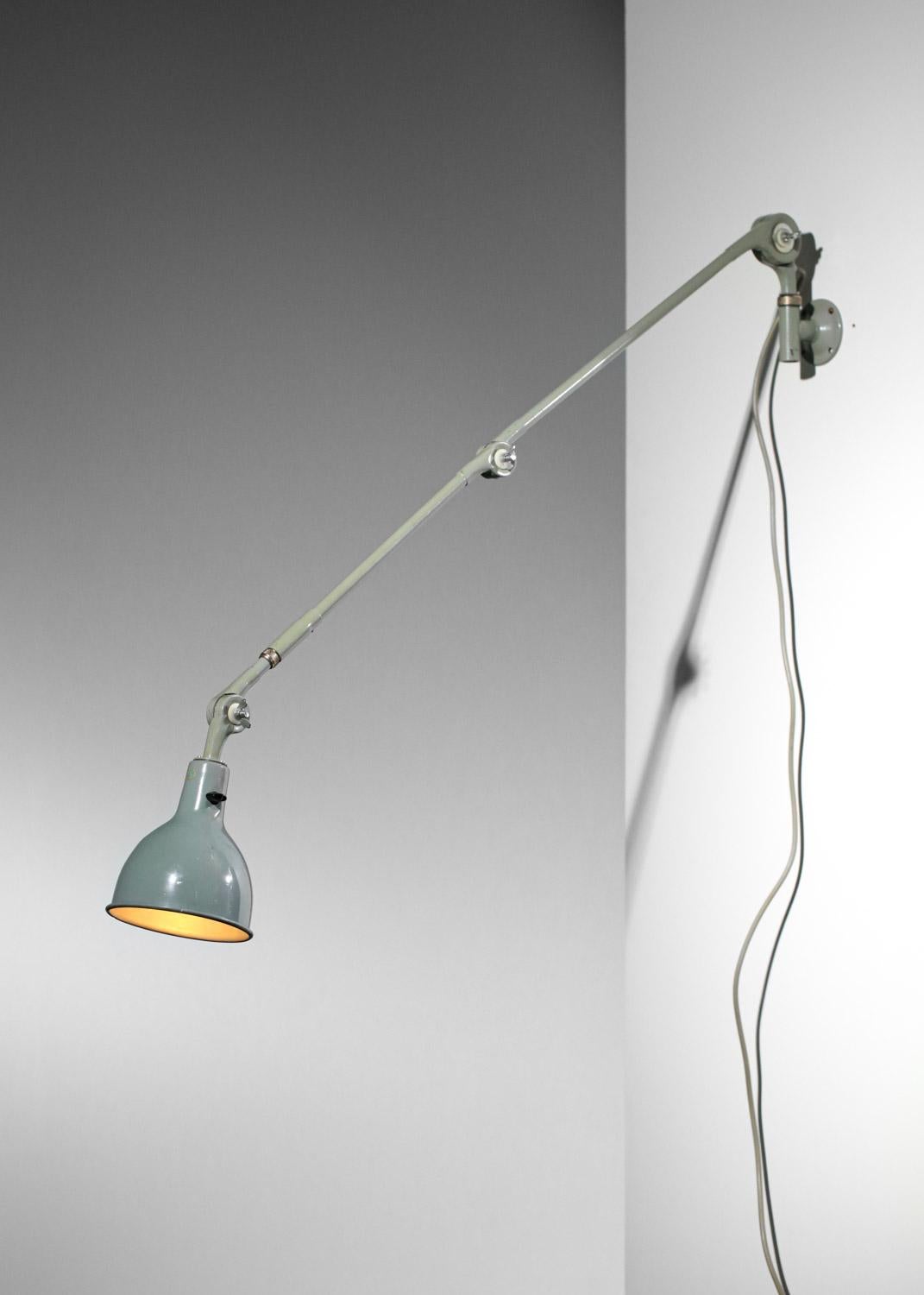 Large 60's Swedish industrial-style wall lamp. Structure and shade in grey/blue lacquered metal (original paint). Articulated arm allows the sconce to be oriented in different positions. Nice vintage condition, slight traces of age and use (see