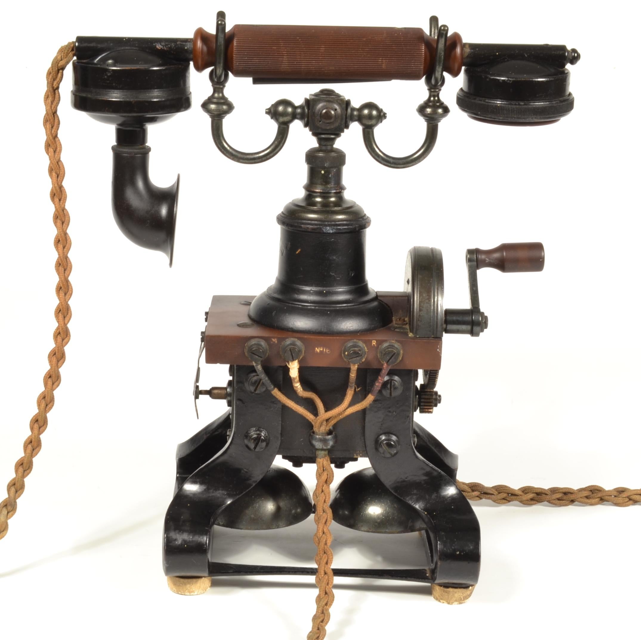 An early GPO type 16 telephone by Ericsson of Sweden. In very good original condition complete with wooden junction box and original leads. These phones have several colloquial names including the coffee grinder, Eiffel tower and skeleton to mention
