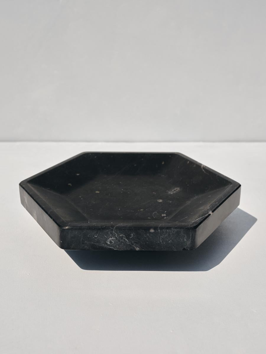 Erifili tray by Faye Tsakalides. 
Dimensions: 25 W x 28.8 L x 6 H cm
Materials: Black Livadia marble.
Technique: Crafted from a single piece of marble. Hand-crafted, Polished. Mat finished. 

Faye Tsakalides, Founder and Creative Director of