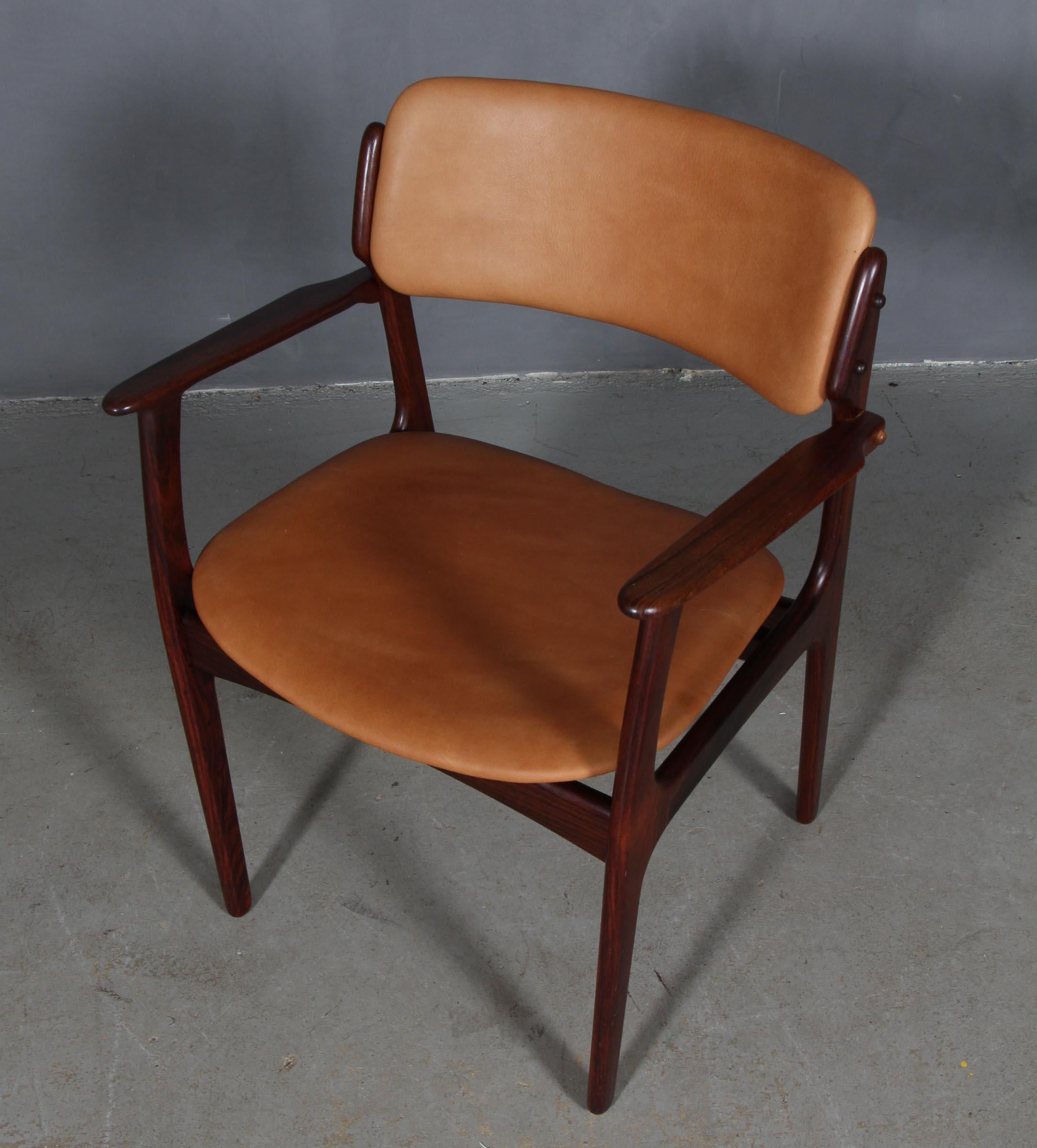 Erik Buch armchair frame of rosewood.

New upholstered with vintage tan aniline leather.

Model 50 made by Odense Maskinsnedkeri, Denmark.