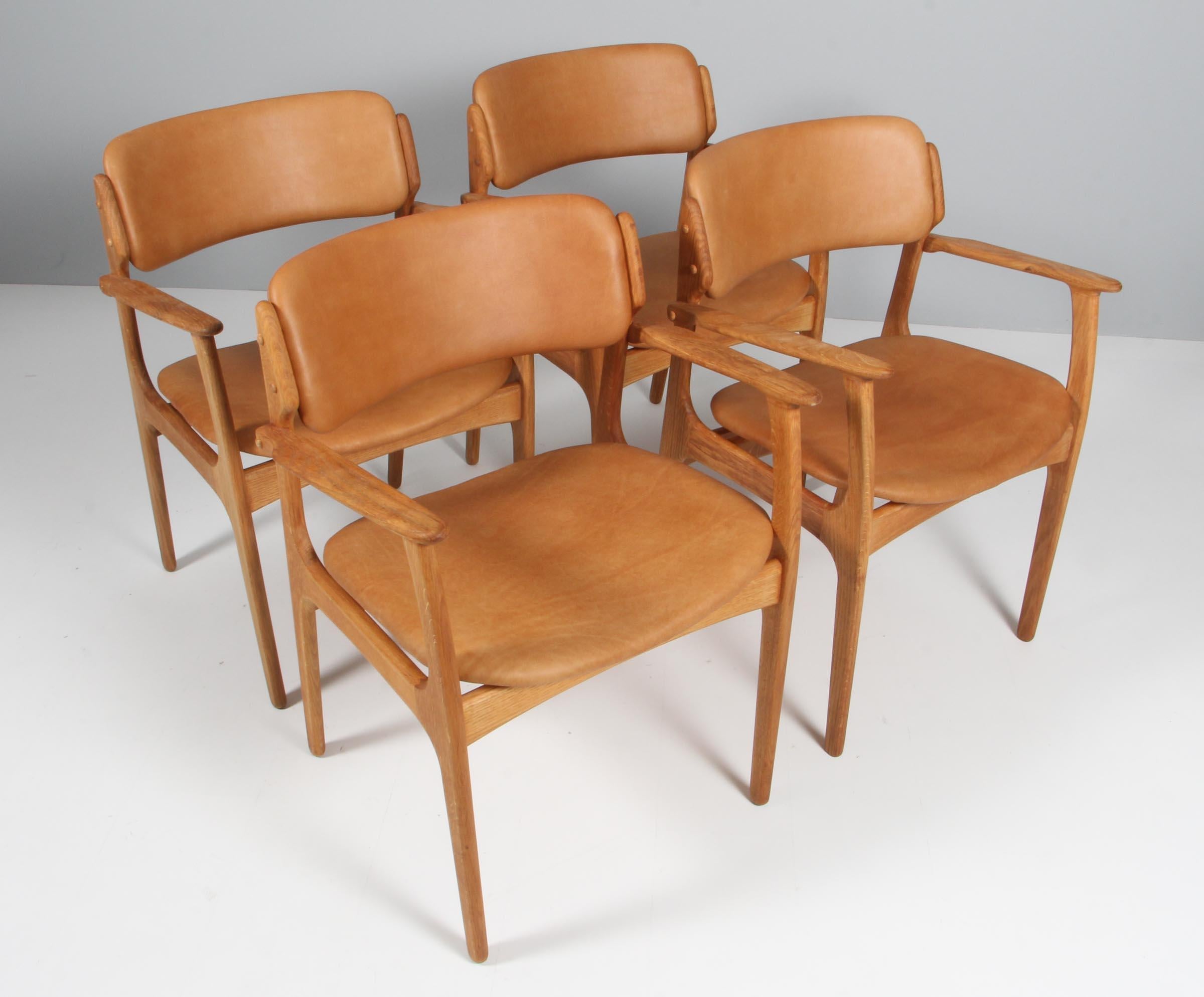 Erik Buch armchair frame of oak.

New upholstered with vintage tan aniline leather.

Model 50 made by Odense Maskinsnedkeri, Denmark.