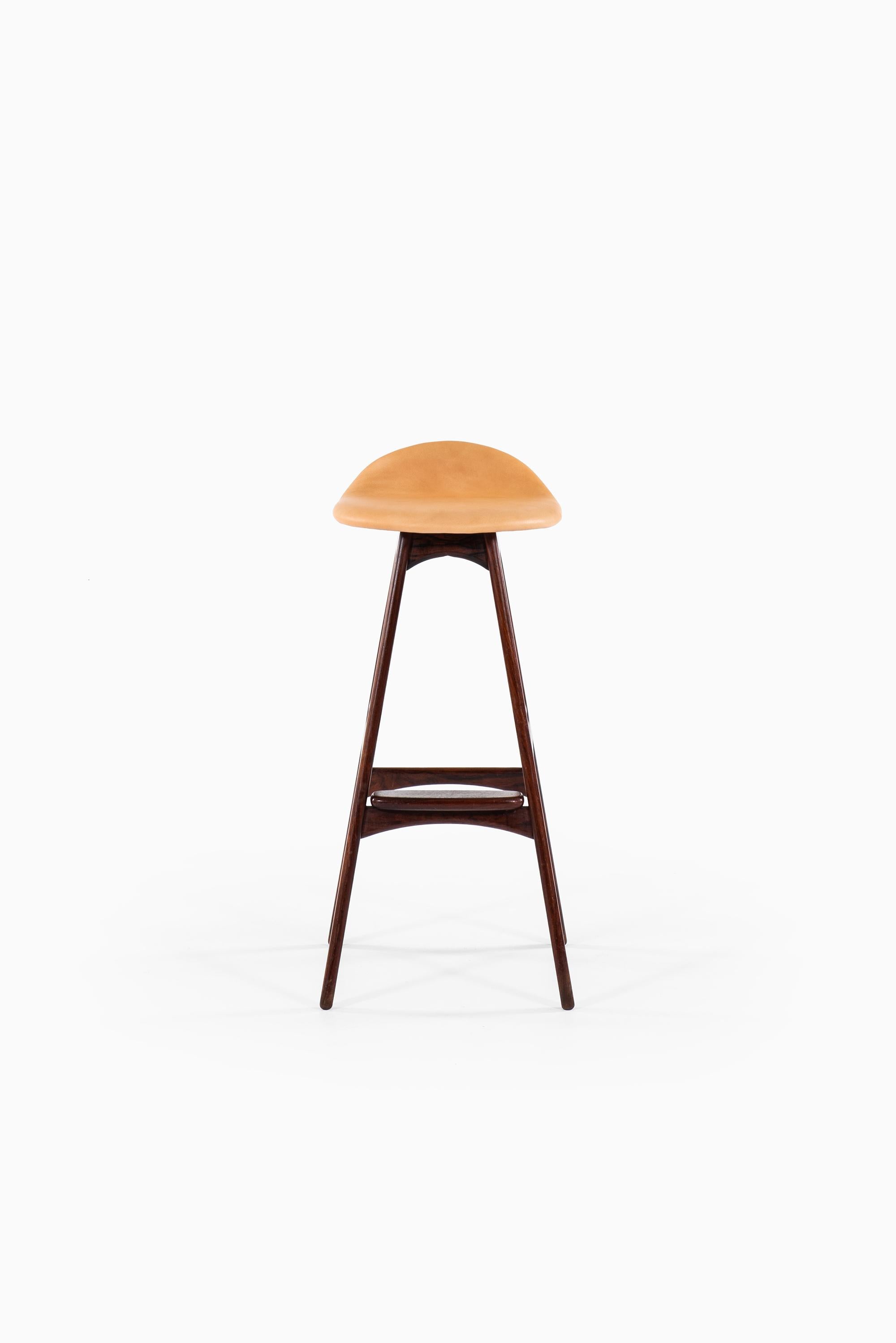 Rare set of 3 bar stools model OD-61 designed by Erik Buch. Produced by Oddense Møbelfabrik in Denmark.