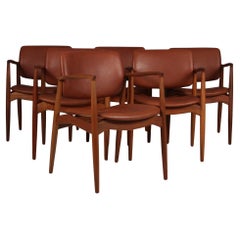 Fauteuils 'Grain' en teck et cuir d'aniline pleine fleur