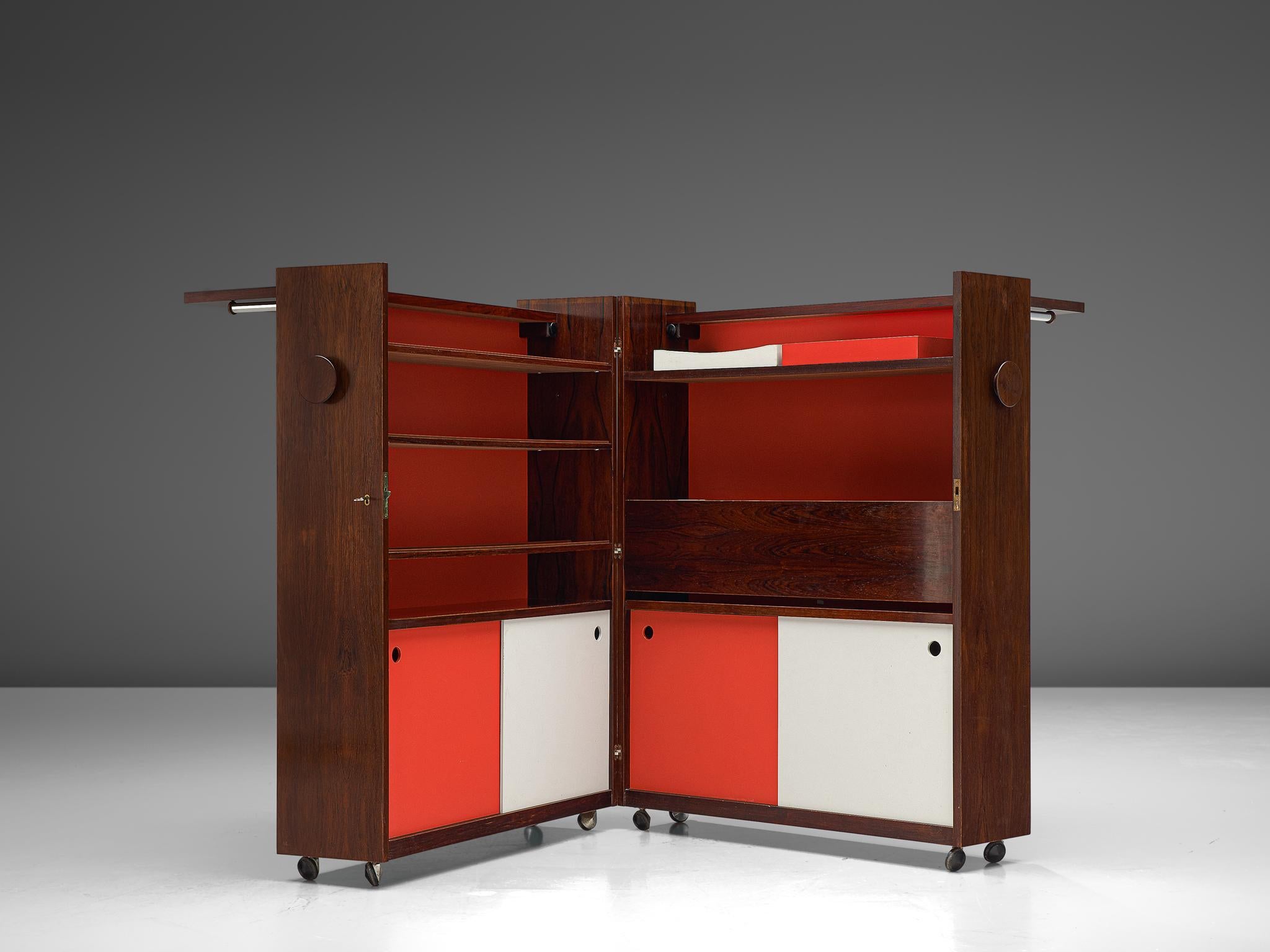 Erik Buch, bar cabinet, rosewood and plywood, Denmark, 1960s

Scandinavian Modern foldable dry bar designed by Eric Buch. The bar features red and white elements on the inside whereas the outside of the bar is made of rosewood featuring a wonderful