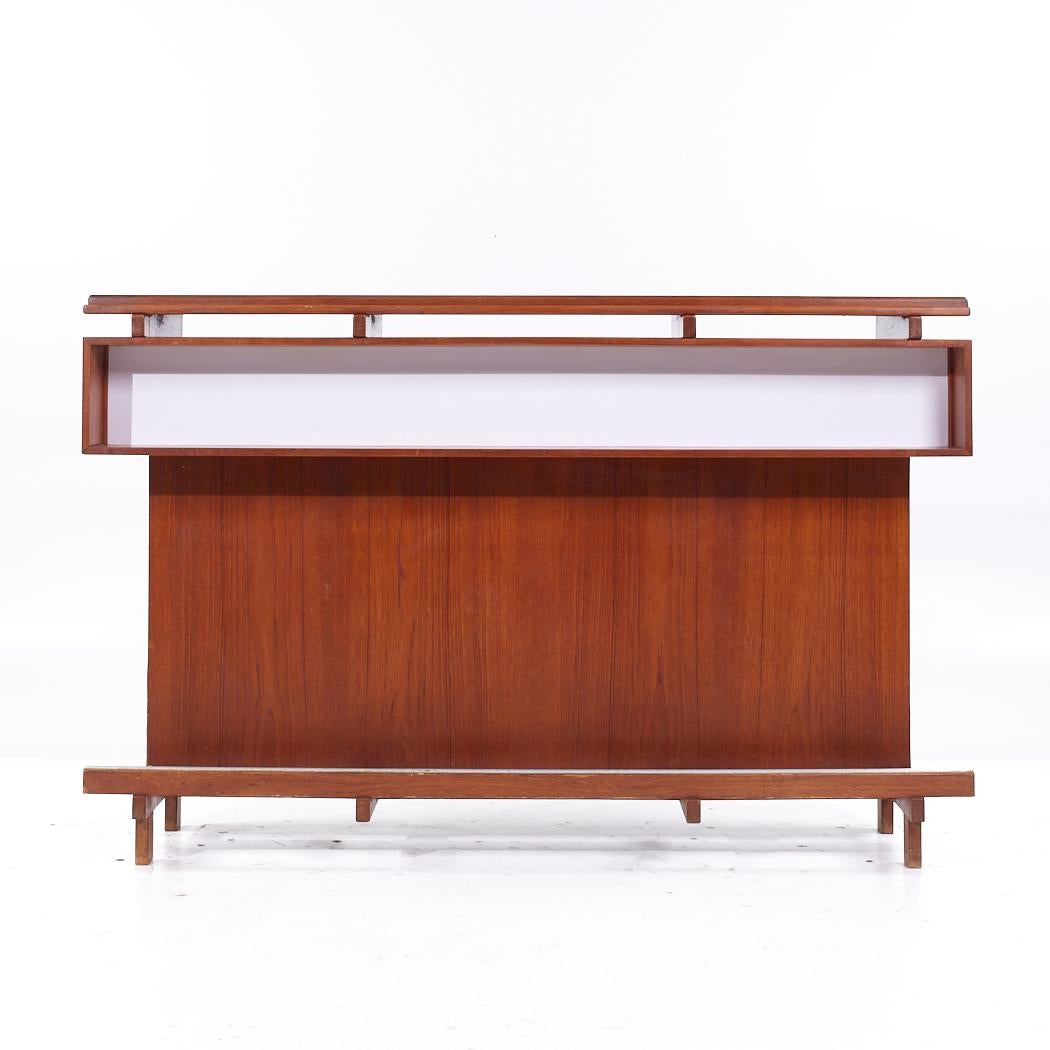 Erik Buch for Dyrlund Mid Century Danish Teak Bar

This bar measures: 71 wide x 20 deep x 45.75 inches high

All pieces of furniture can be had in what we call restored vintage condition. That means the piece is restored upon purchase so it’s free
