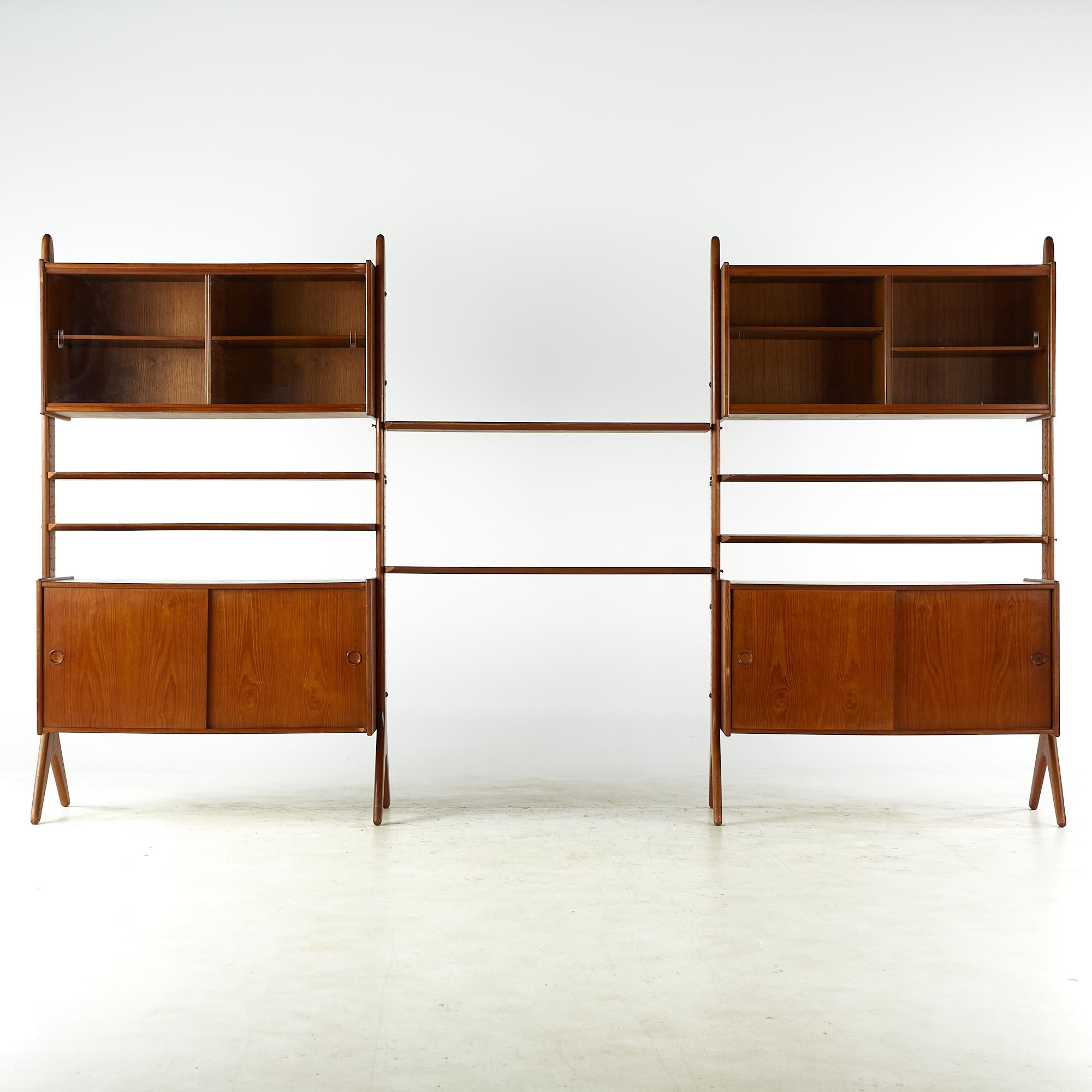 Erik Buch midcentury 3 bay teak Freestanding wall unit

This wall unit measures: 123 wide x 17.5 deep x 70.75 inches high

All pieces of furniture can be had in what we call restored vintage condition. That means the piece is restored upon