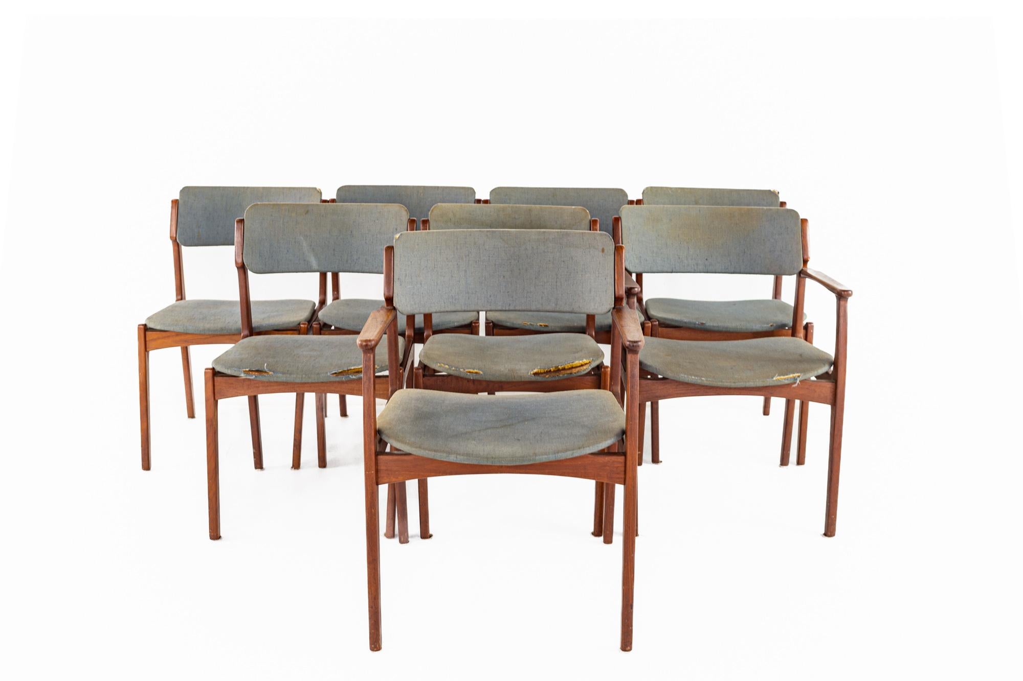 Erik Buch mid-century teak dining chairs - set of 8.

Each chair measures: 23 wide x 17 deep x 33 high, with a seat height of 16 and arm height of 25 inches.

Ready for new upholstery. This service is available for an additional fee.

All