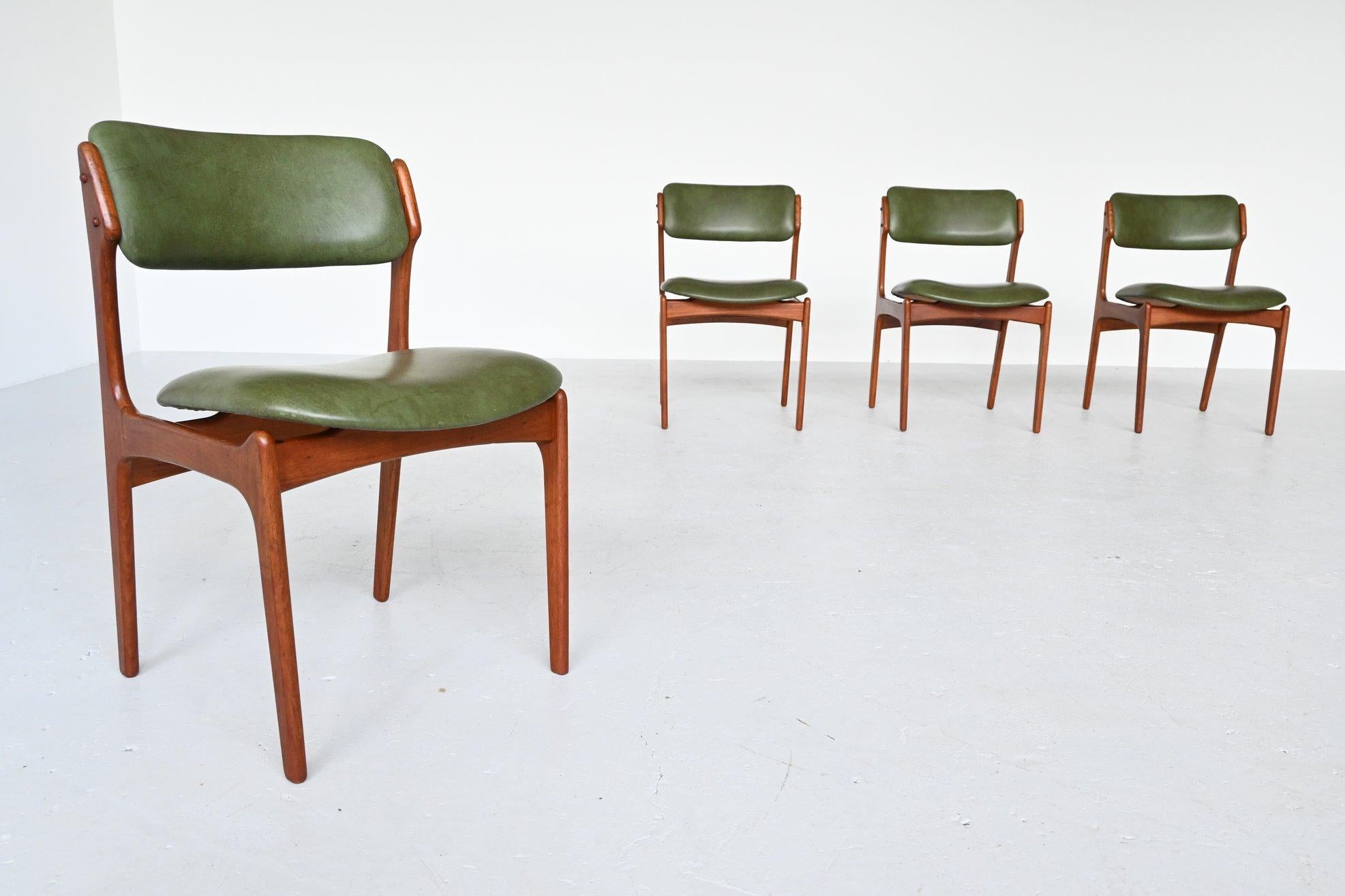 Beautiful shaped dining chairs model 49 designed by Erik Buch and manufactured by Oddense Maskinsnedkeri, Denmark 1960. The chairs feature a solid teak wooden frame and the floating seats are upholstered in original green faux leather. They seat