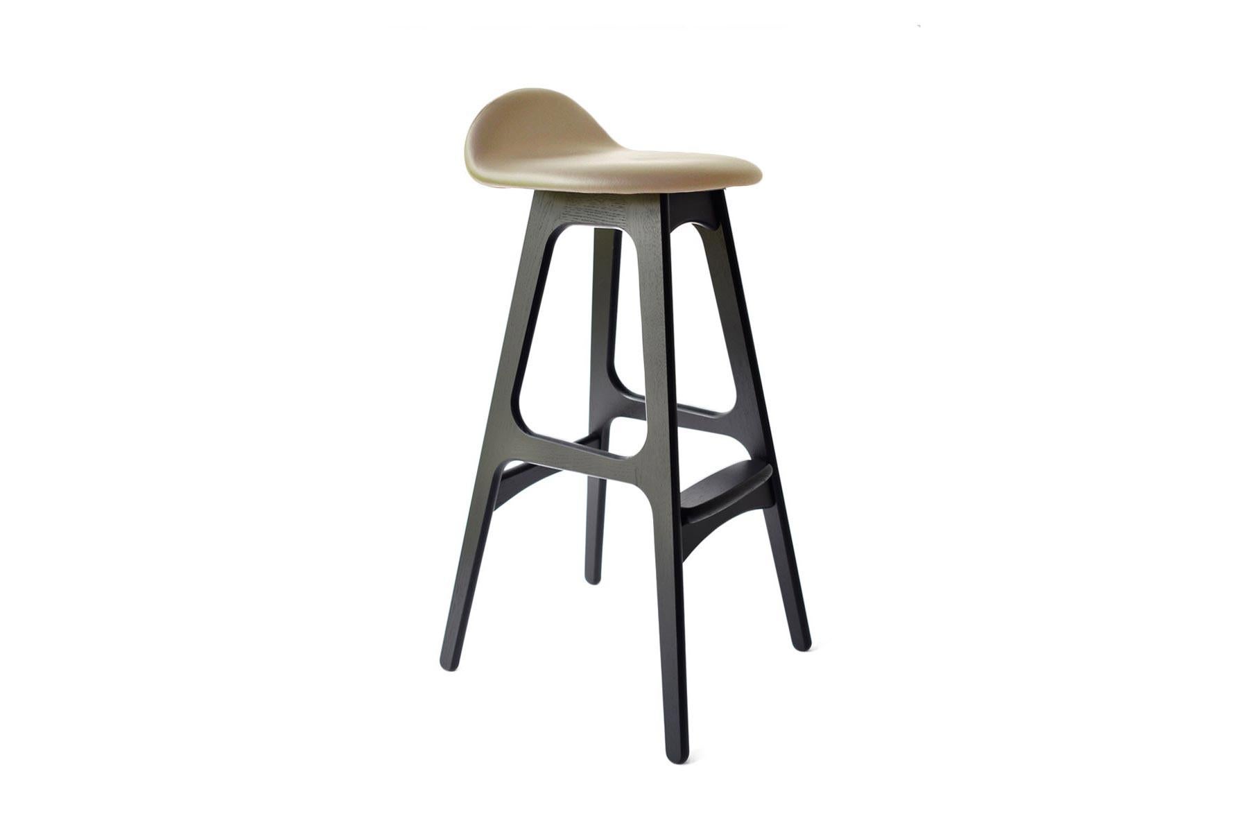 Originally produced in the 1960s, the Model 61 counter stool designed by Erik Buch is a beautiful example of Danish modern design. In production again for the first time, this instant classic is perfectly suited for any modern home or office, and