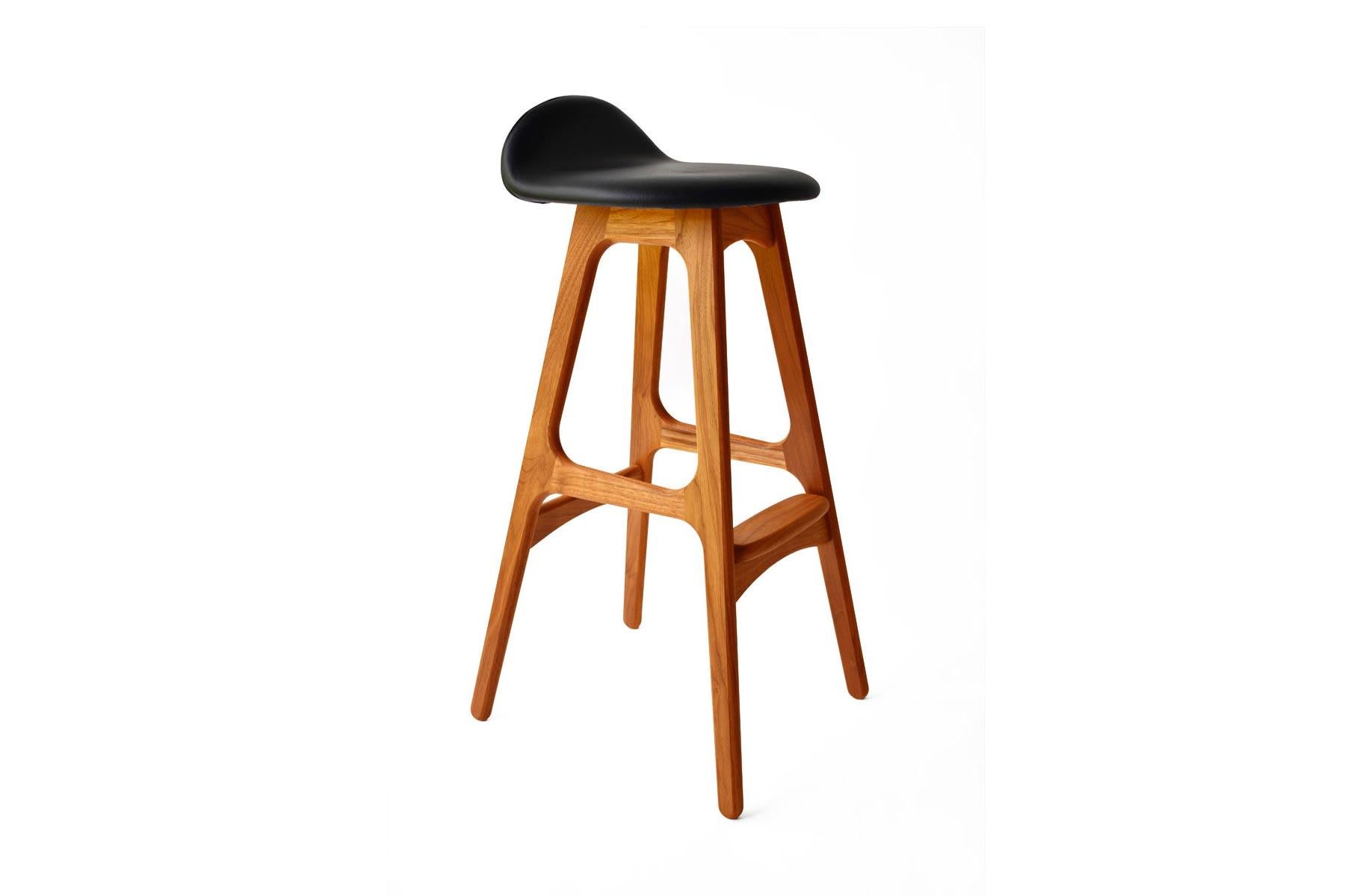 Originally produced in the 1960s, the Model 61 counter stool designed by Erik Buch is a beautiful example of Danish modern design. In production again for the first time, this instant classic is perfectly suited for any modern home or office, and