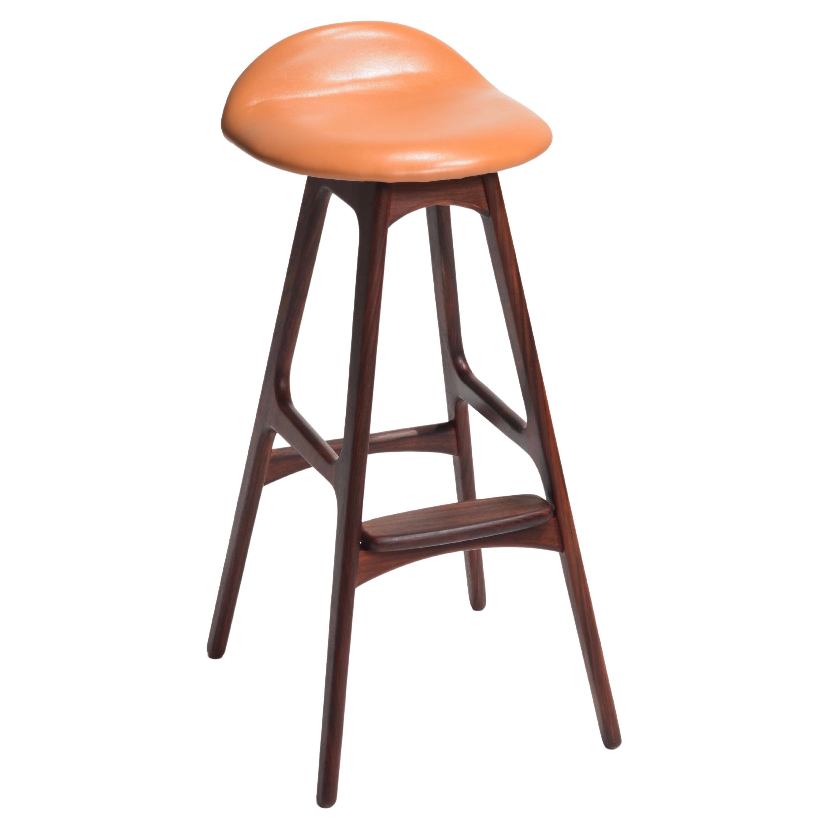 The Erik Buch Bar Stools Model OD-61, crafted by the renowned Danish furniture manufacturer Oddense Møbelfabrik, are a striking embodiment of Scandinavian design excellence. These iconic bar stools are a testament to the timeless appeal of