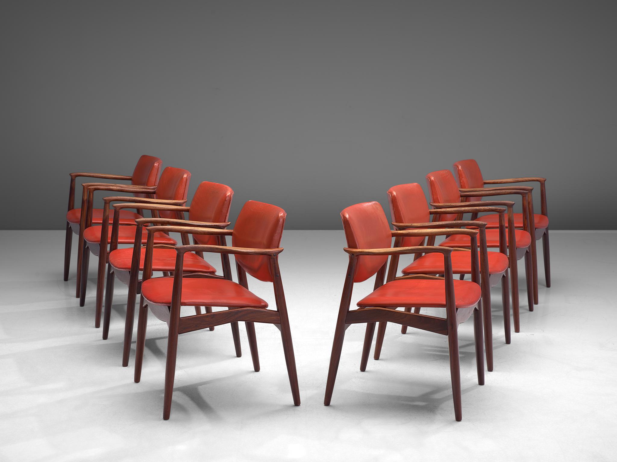 Erik Buch, set of eight dining chairs model 50, rosewood and red leather, Denmark, 1960s.

These solidly constructed rosewood chairs show elegant lines and stunning wood connections. This set of six, best known as 'model 50', shows the Danish