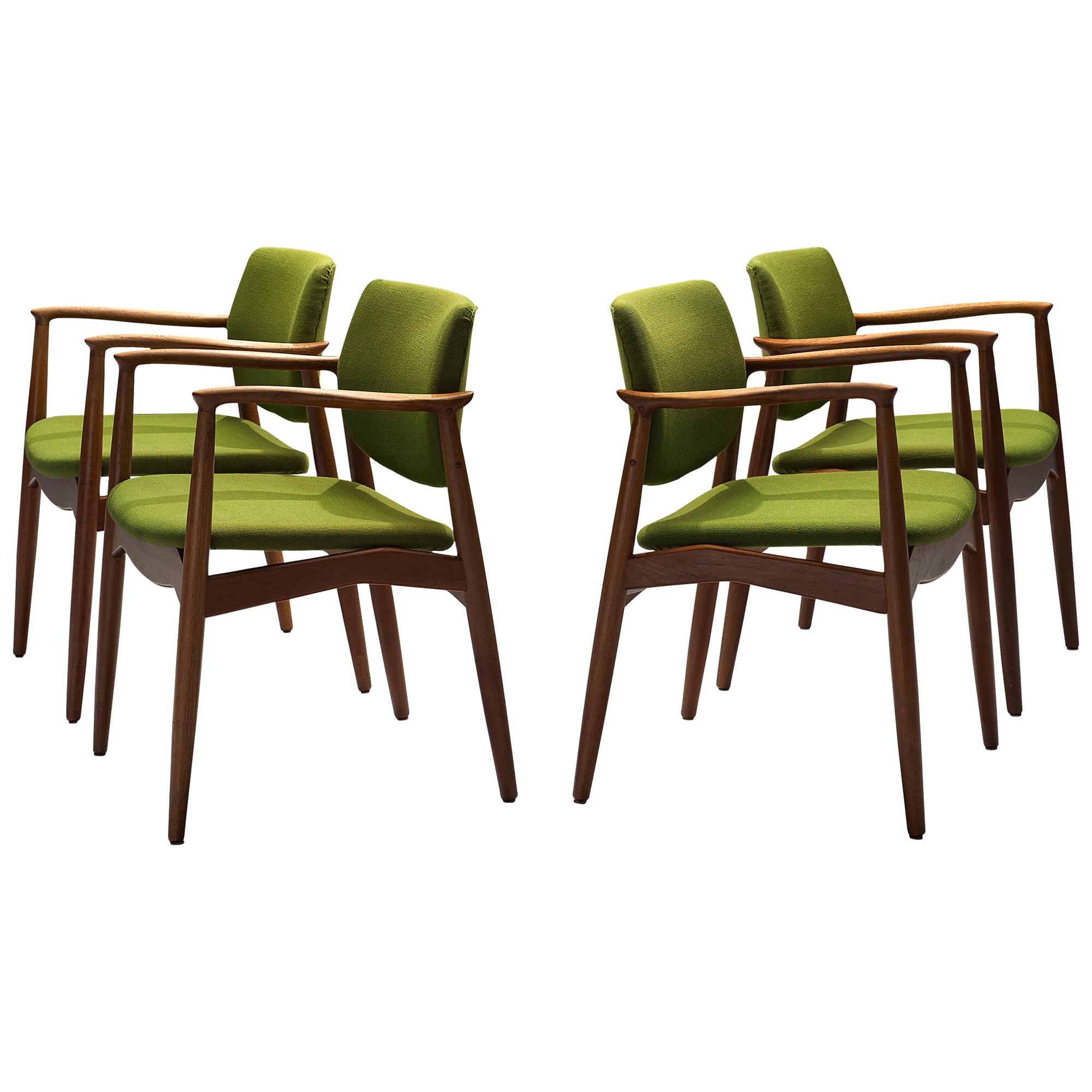 Eric Buch for Ørum Møbler, set of four 'Captains' armchairs, teak, green fabric upholstery, Denmark, 1957

Set of four sculpted dining chairs in solid teak. These chairs show the characteristics of the well-known model 50 by Erik Buck. Yet this