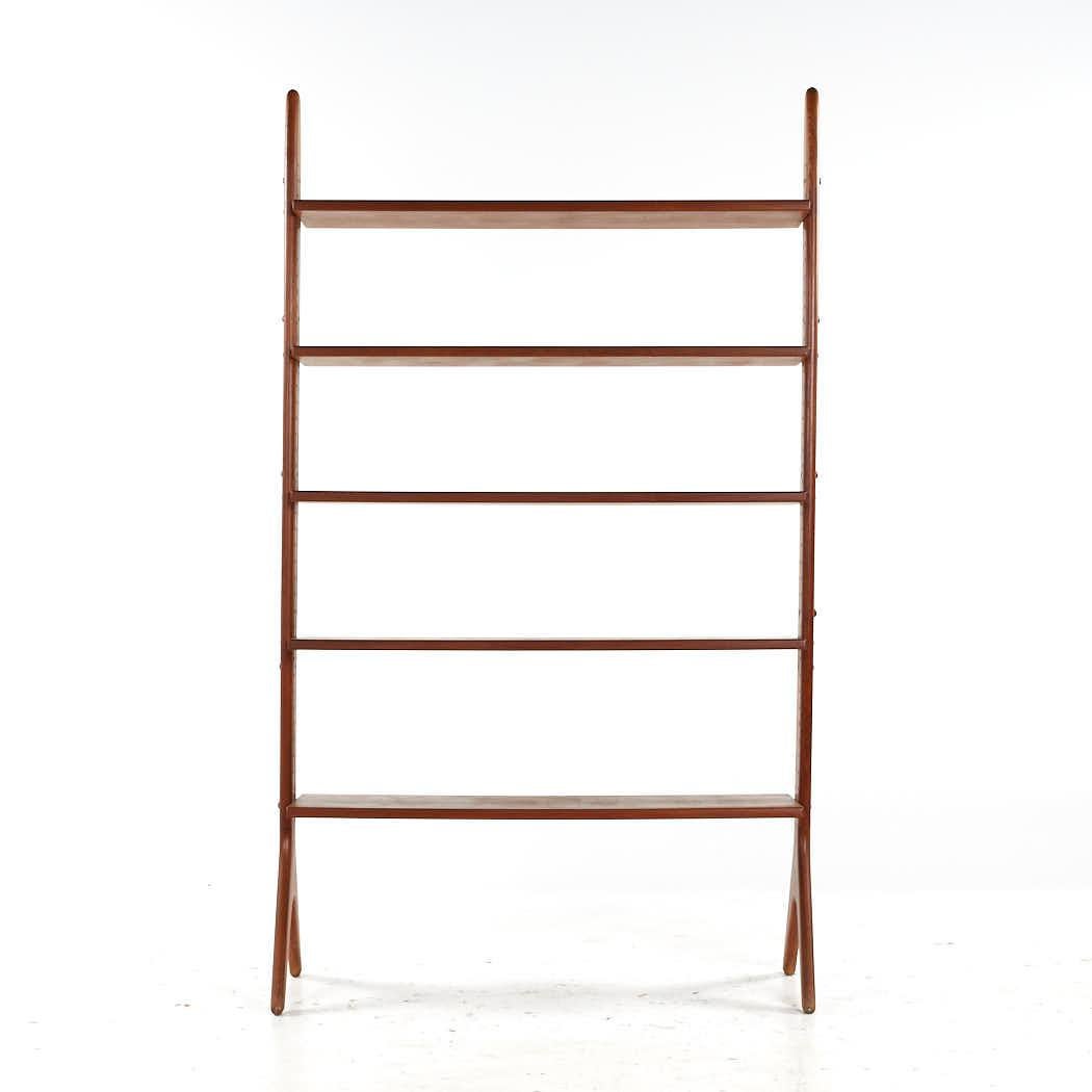 Erik Buch Style Mid Century Danish Teak Freestanding Wall Unit

This wall unit measures: 41.5 wide x 17.25 deep x 70.75 inches high

All pieces of furniture can be had in what we call restored vintage condition. That means the piece is restored upon
