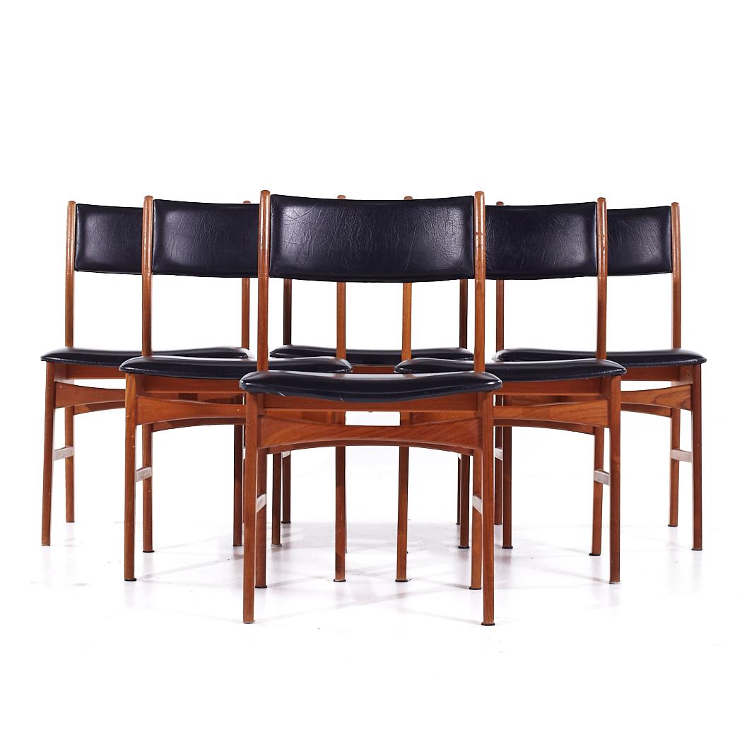 Erik Buch Style Mid Century Teak Dining Chairs - Set of 6

Each chair measures: 19.5 wide x 16 deep x 32.25 inches high, with a seat height/chair clearance of 18 inches

We take our photos in a controlled lighting studio to show as much detail as