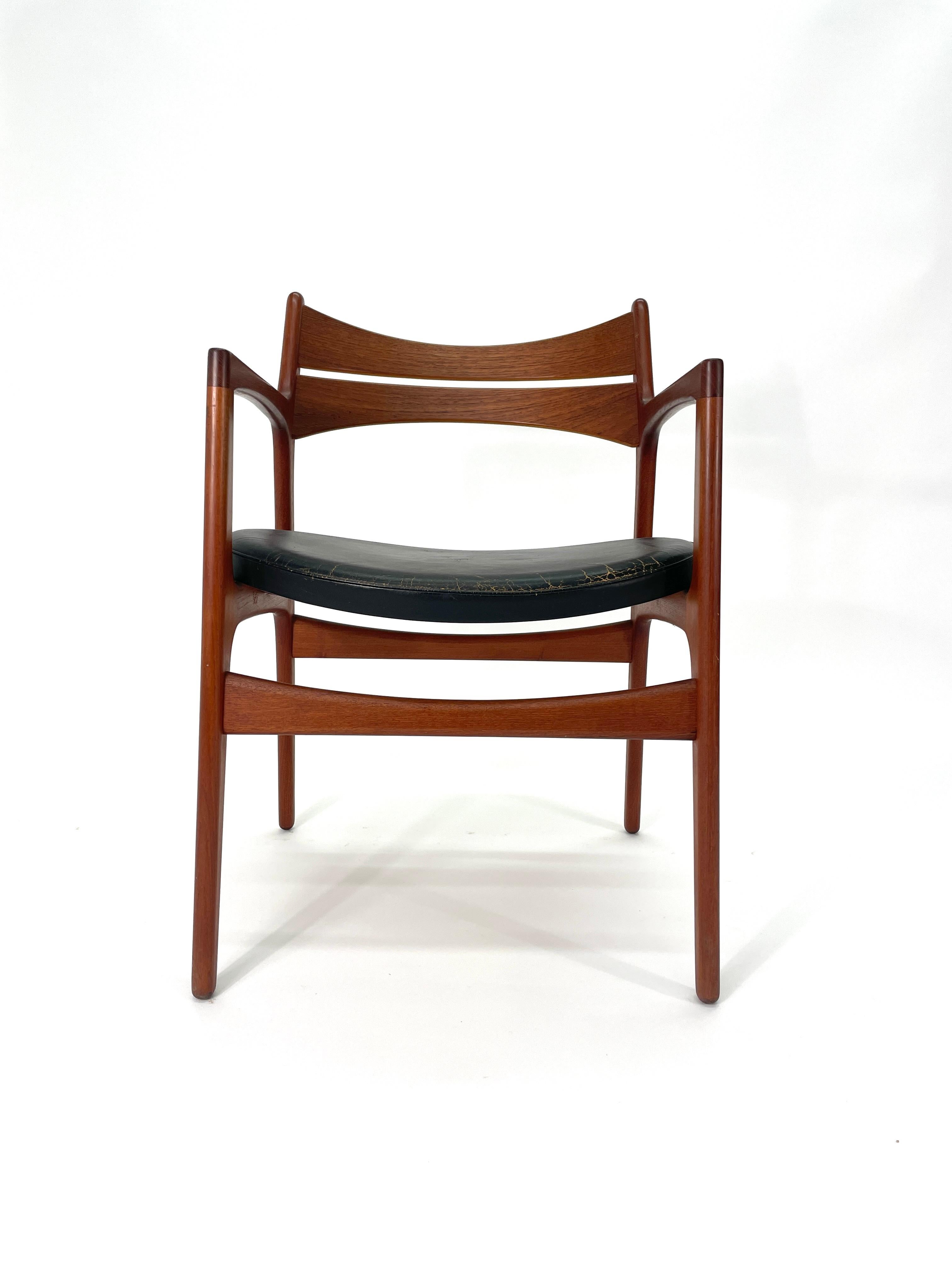 Mid-Century desk chair designed by Erick Buch for Christiansen Møbelfabrik Denmark (only one pictured). Features a solid teak frame and beautifully curved backrest that provide support and comfort. Solid wood legs feature arched cross braces for
